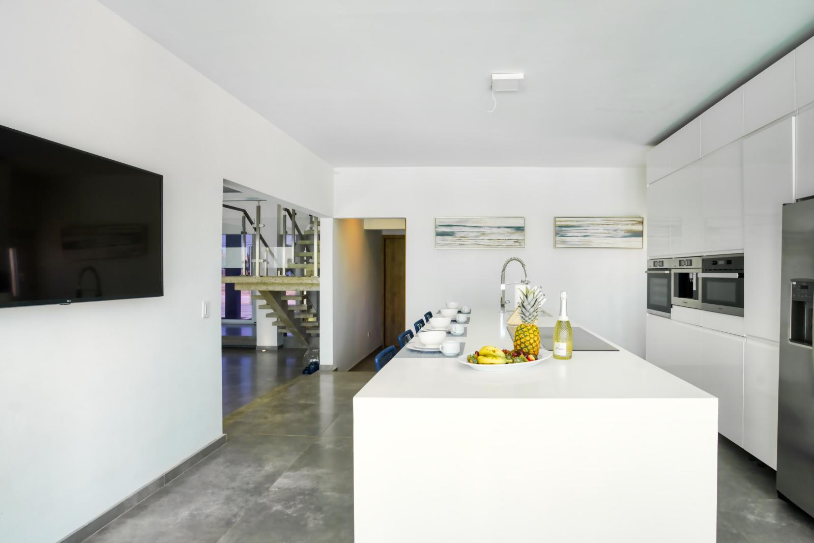 Fuel your day at our kitchen's inviting breakfast bar – the perfect spot to savor morning coffee or whip up a quick bite before your adventures begin.
