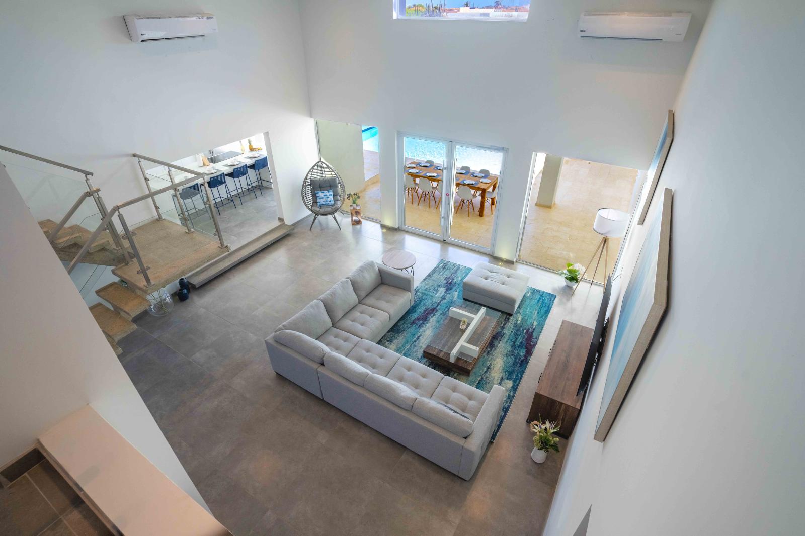 Spacious Living Area of the Villa in Noord Aruba - Smart TV and Netflix - Premium quality fixtures and fittings - Access to outdoor dining options for added versatility - Harmonious blend of textures and materials