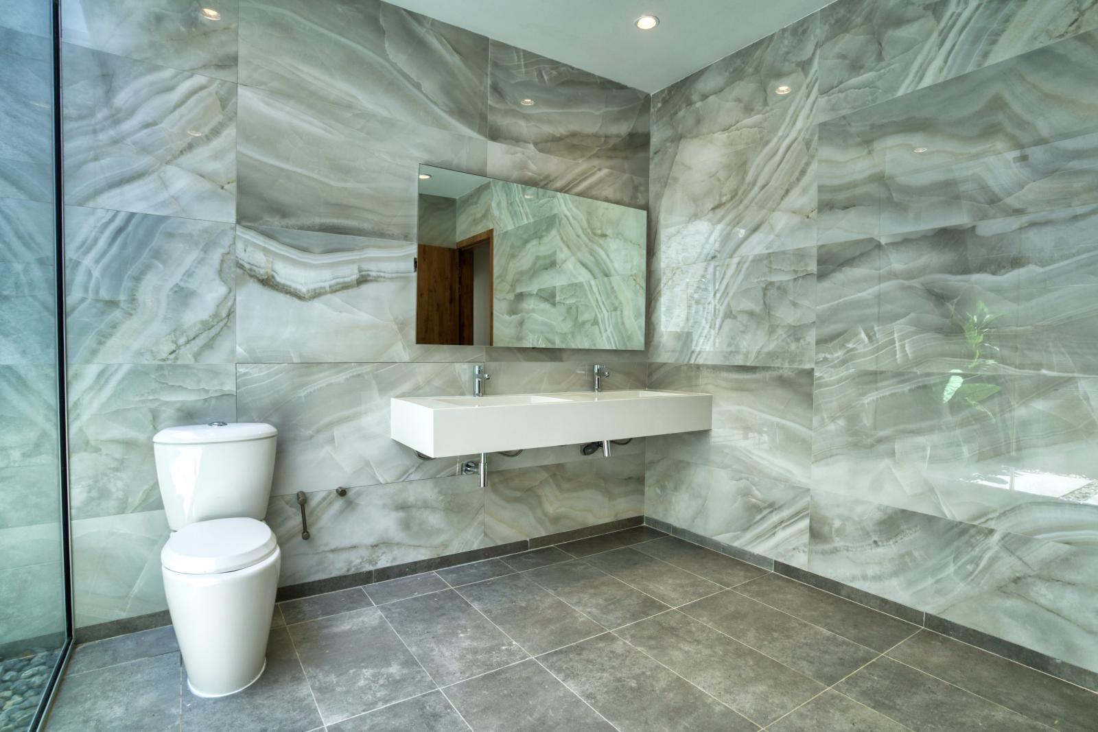 Elevate your bathroom experience with a sleek floating vanity in Bathroom 1 – where modern design meets everyday luxury.