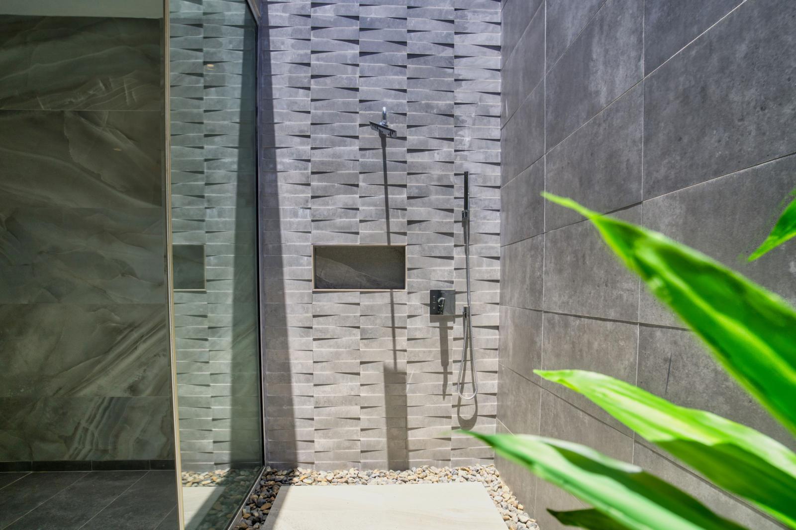 Immerse yourself in a refreshing shower experience in Bathroom 1, where natural light pours in, creating a serene ambiance that invigorates both body and mind.