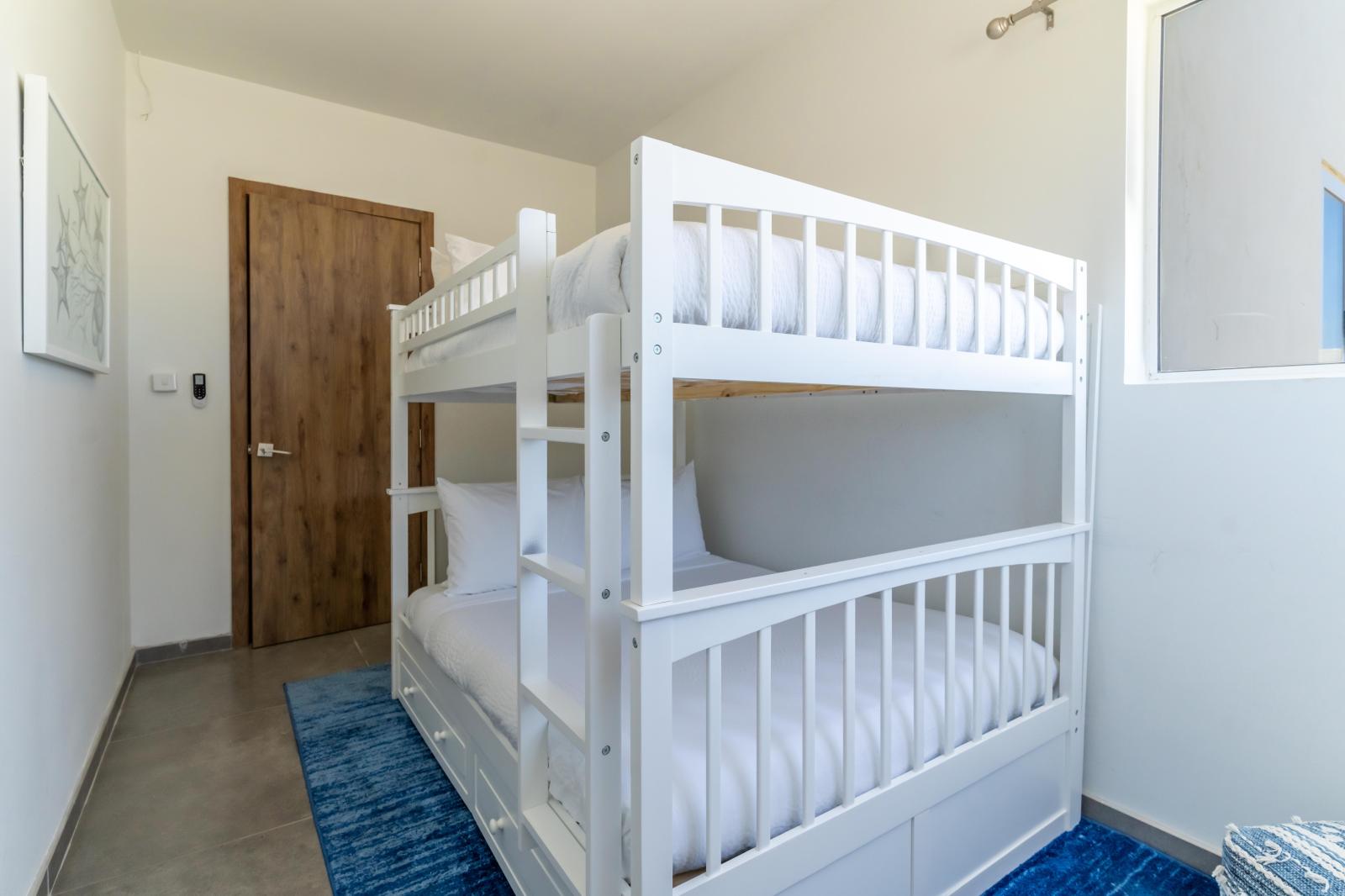 Lovely Bedroom of the Villa in Noord Aruba - Comfy bunker bed - Well-appointed bedroom with neutral tones for a calming atmosphere - Smart use of space