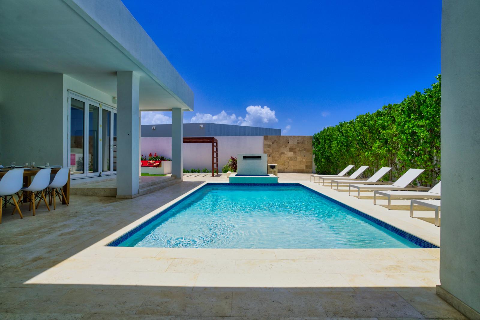 Escape to our expansive, modern pool area, complete with chic lounge chairs – a serene oasis where you can bask in the sun and unwind in style.