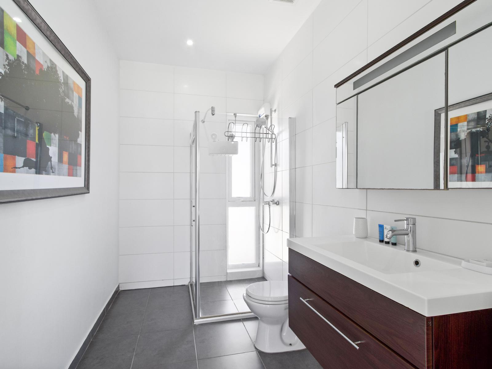 Pamper yourself in the spacious ensuite bathroom of the master bedroom, designed for relaxation and convenience.