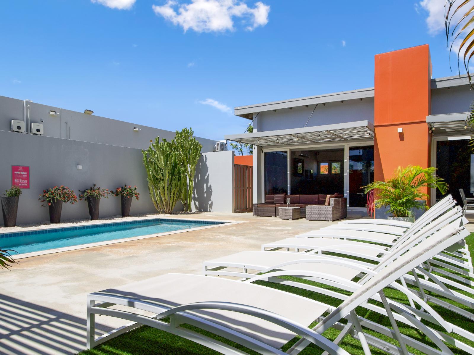 Lounge chairs by the pool for soaking up the sun