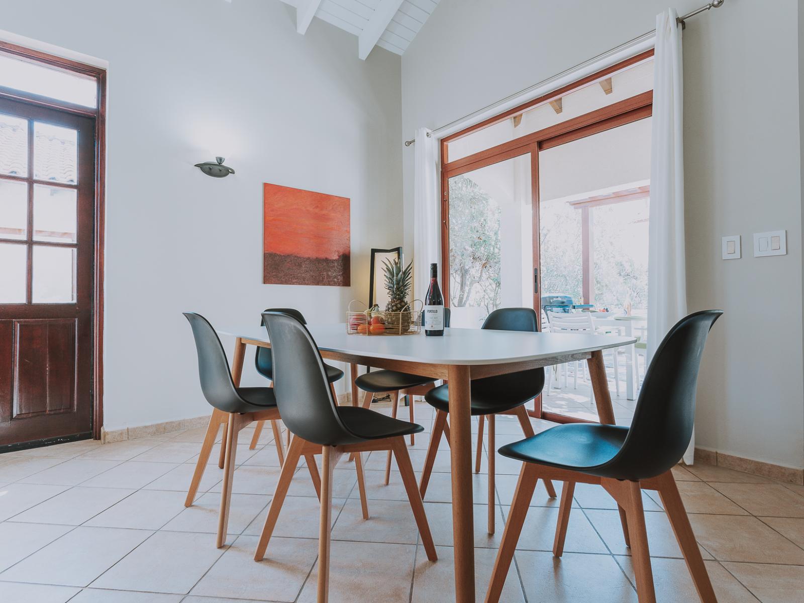 Gather around our inviting dining table and savor the joy of shared meals together. Whether it's a hearty breakfast to start the day or a leisurely dinner to unwind, our spacious table provides the perfect setting for cherished moments and lively conversat