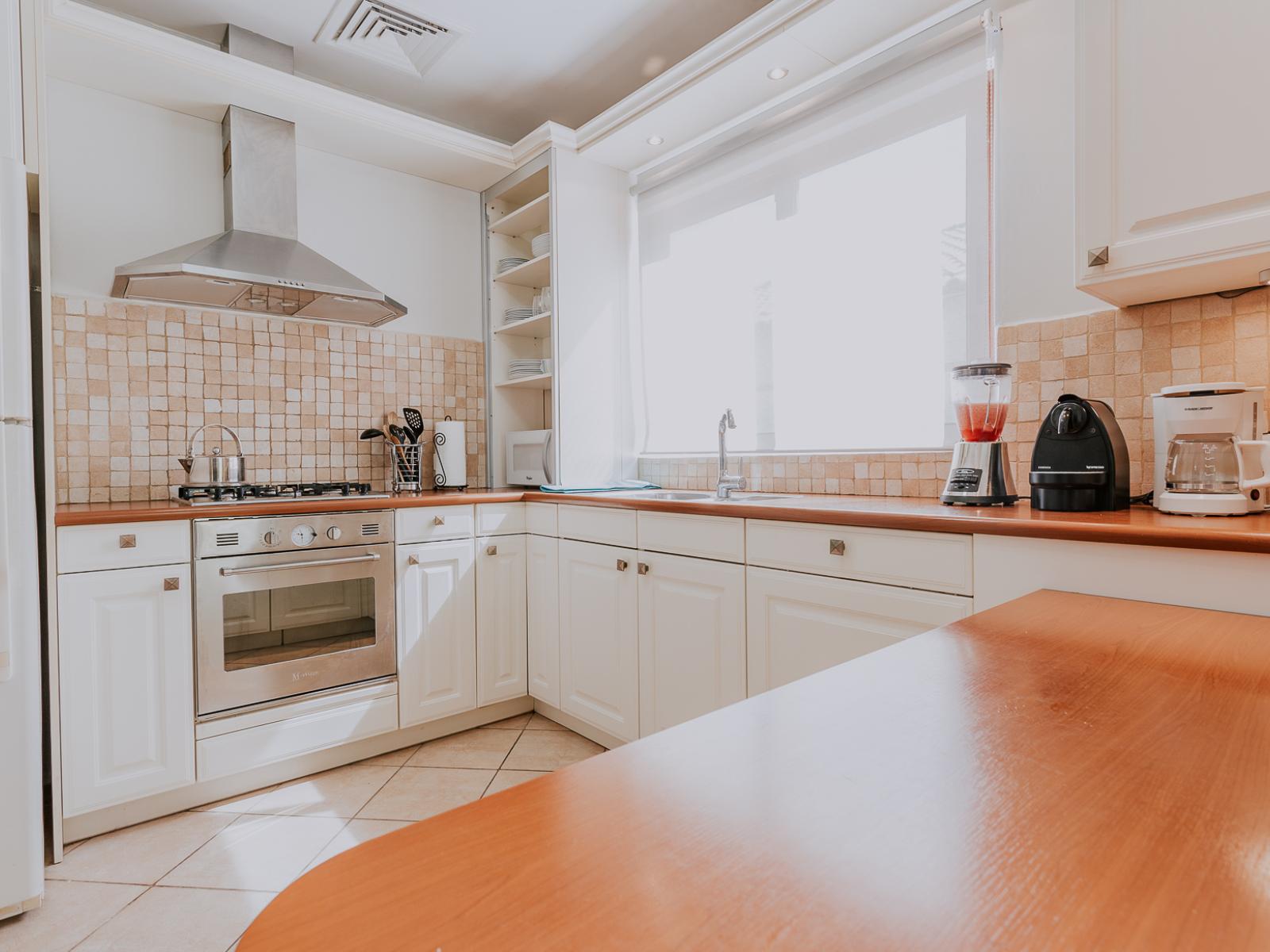 Discover the heart of our villa in our kitchen, ready and waiting for homemade meals to be created. Stocked with modern appliances and cooking essentials, it's the perfect space to unleash your culinary creativity.