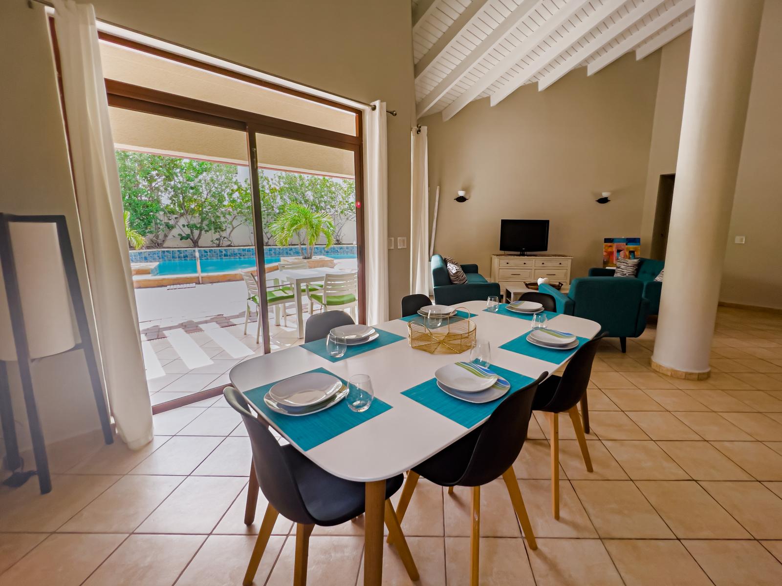 Wonderful dining area of the 3BR house in Noord Aruba - 6 Persons Beautiful Dinning - Private space with mesmerising pool views  - Availability of TV and Netflix - Elegant Decor - Soul enhancing space