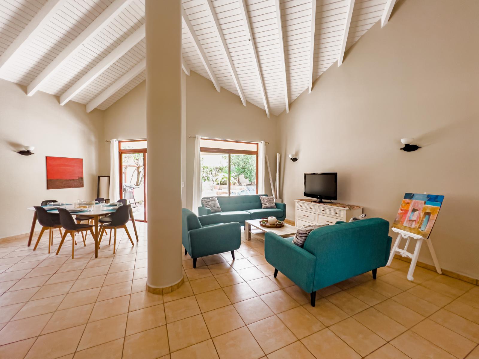 Exclusive Living and dining area of the 3BR house in Noord Aruba - Cosy sofas - Wonderful large windows for light and air with mesmerising views - 6 Persons Dinning   - Availability of TV and Netflix