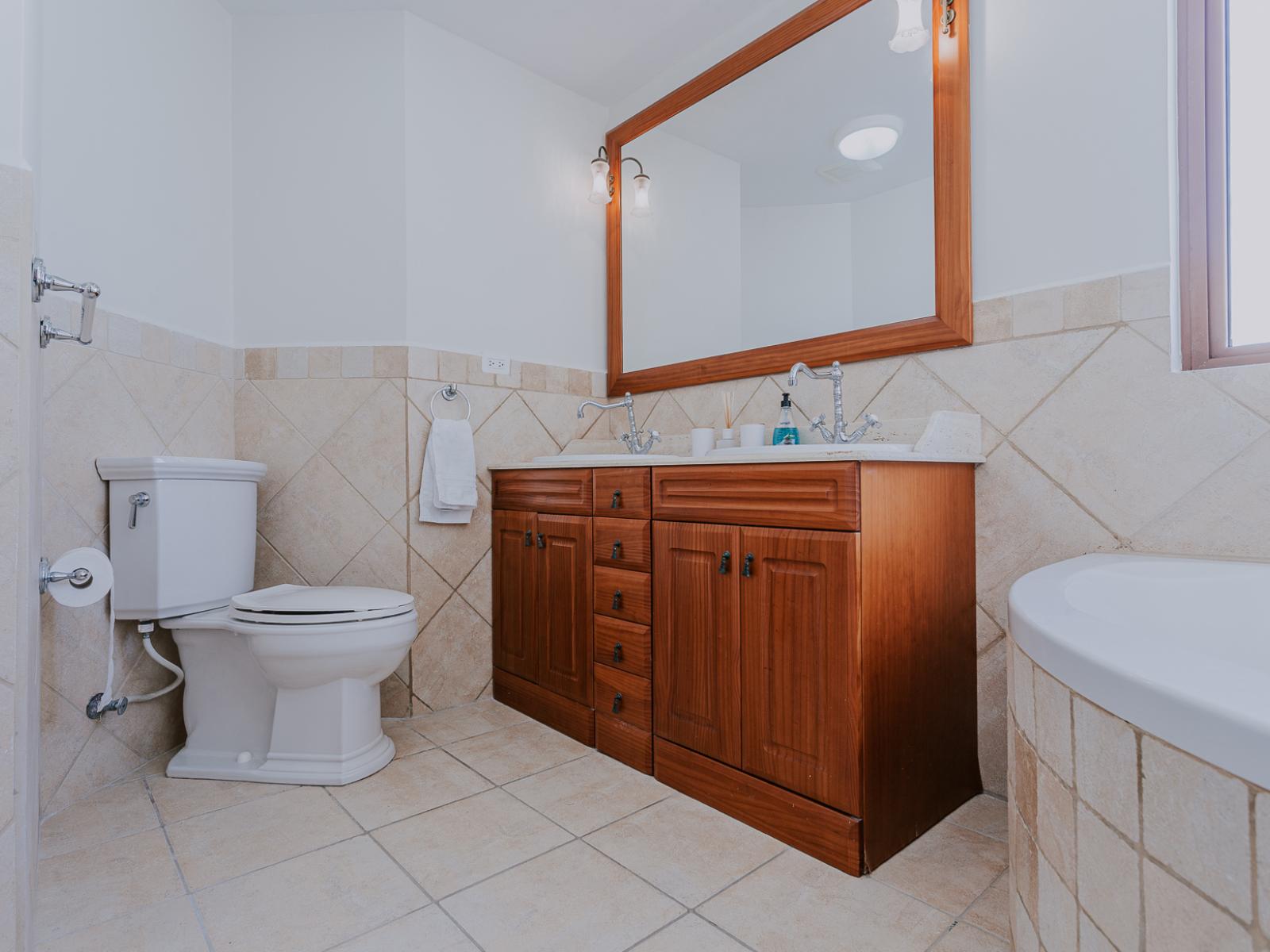 Enjoy the convenience of Bathroom 1, seamlessly connected to Bedroom 1 for your privacy and comfort. With modern fixtures and elegant design, this ensuite offers a tranquil retreat where you can unwind and refresh in style.