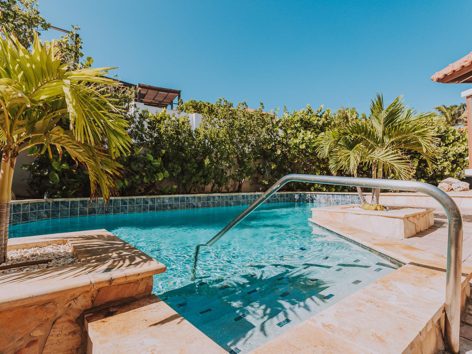 Immerse yourself in serenity and luxury with our private pool, a refreshing oasis just steps from your door. Surrounded by lush greenery and bathed in sunlight, it's the perfect place to unwind and recharge.