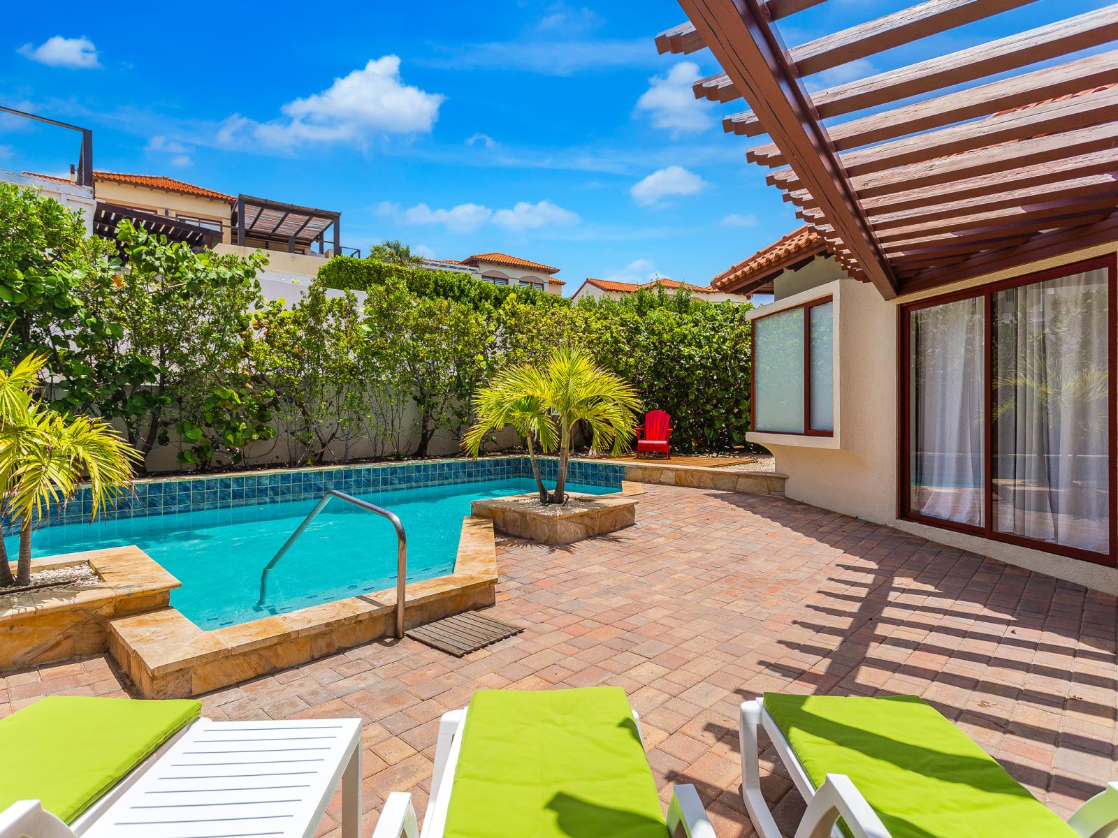 Bask in the sun and unwind in style with our abundance of poolside lounging chairs. Whether you're seeking a spot to soak up some rays or simply relax with a good book, our spacious pool area offers plenty of comfortable seating options.