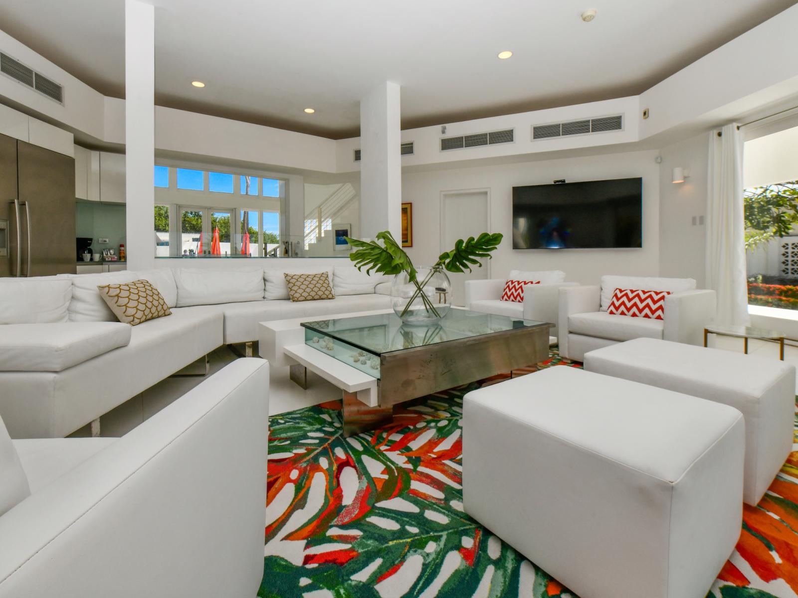 Plush Living Area of the Villa in Noord Aruba - Comfortable seating arrangements - Stylish, contemporary furnishings enhancing the aesthetic - Smart TV and Netflix - Flexible seating options for comfort and adaptability - Ocean views