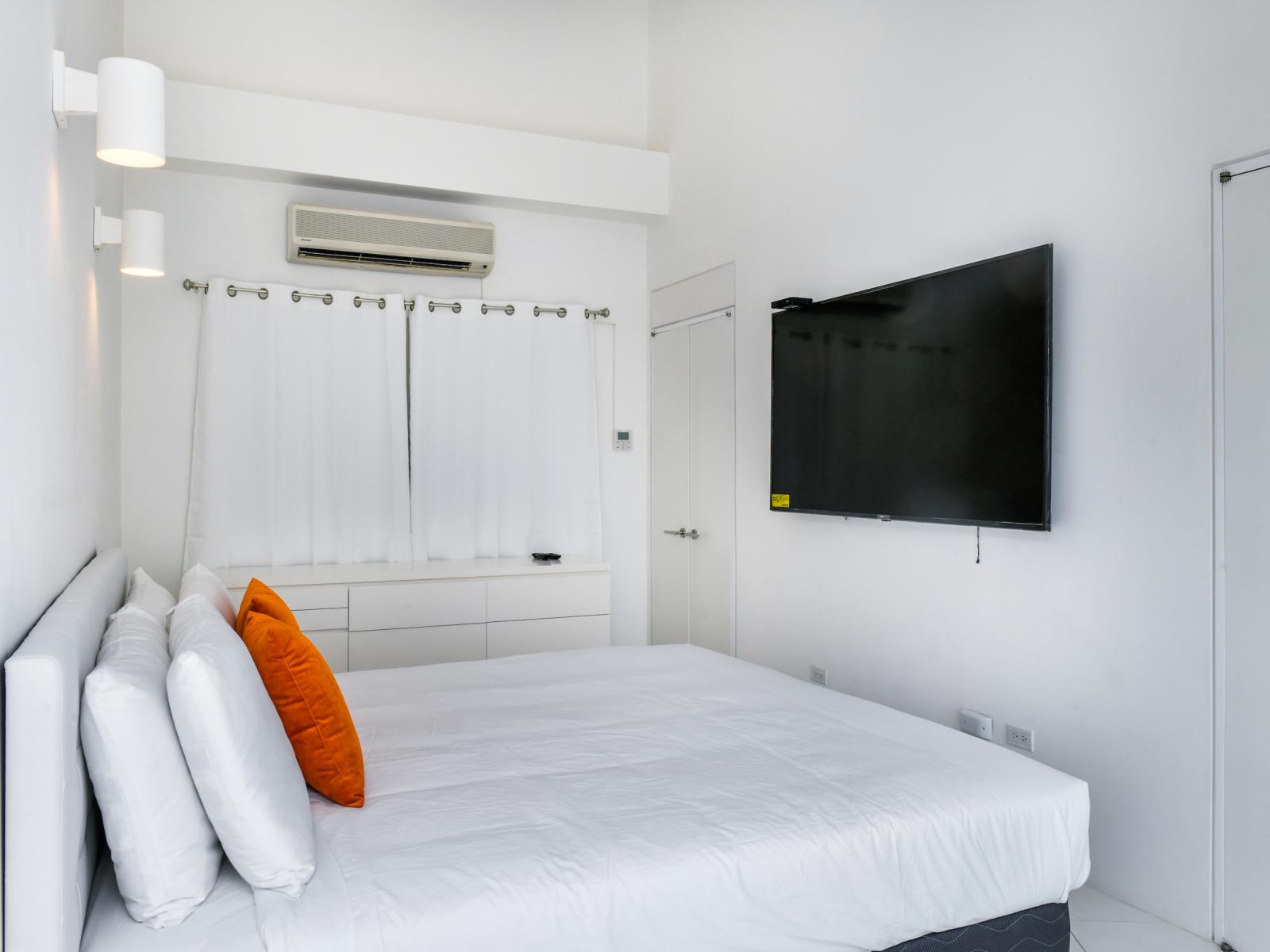 Indulge in comfort and privacy in our beautifully appointed bedroom, complete with a luxurious king bed, entertainment at your fingertips with a TV, and an en-suite bathroom for added convenience.