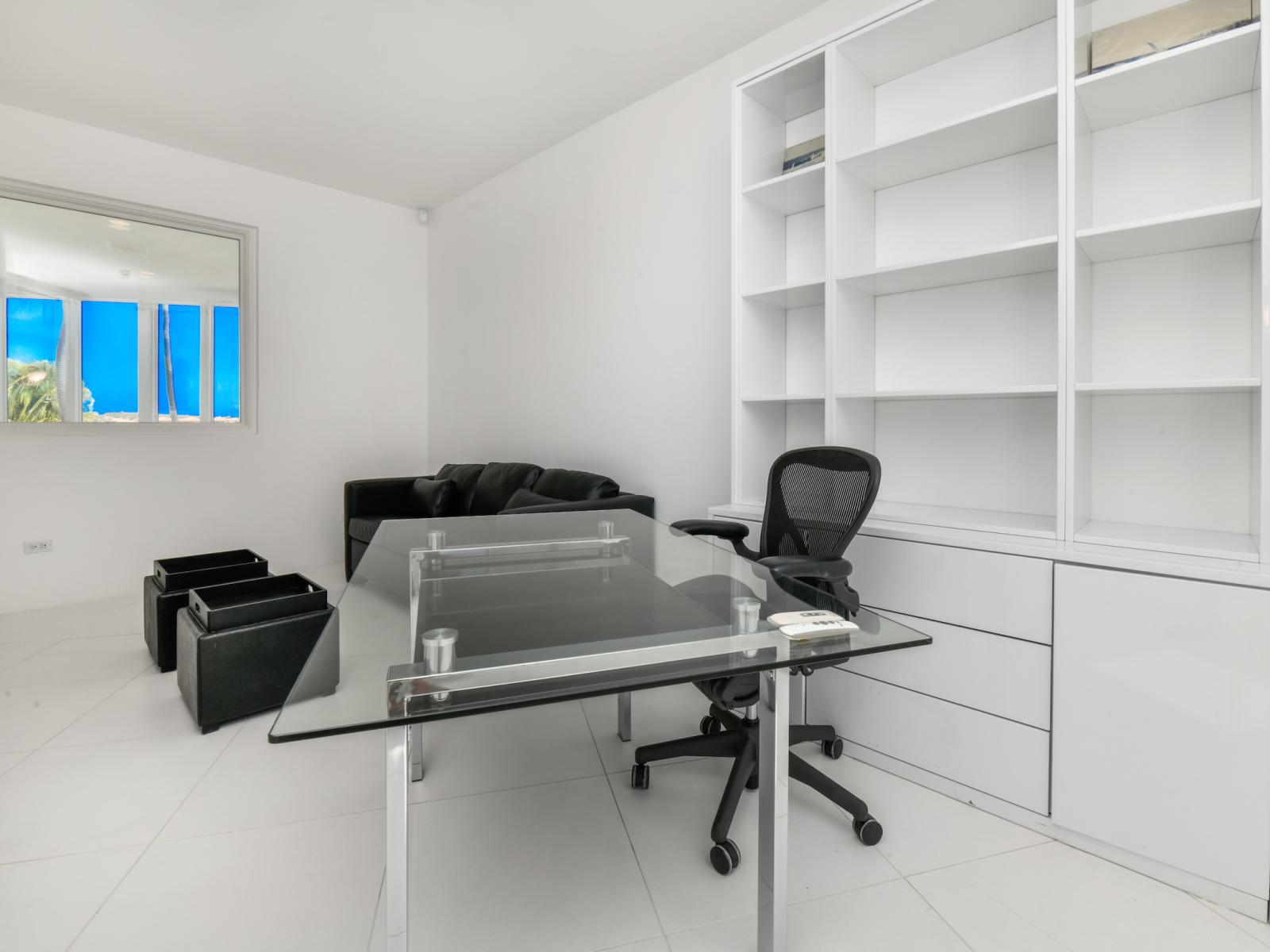 Maximize your productivity in our dedicated office area, featuring a spacious desk where inspiration meets efficiency.