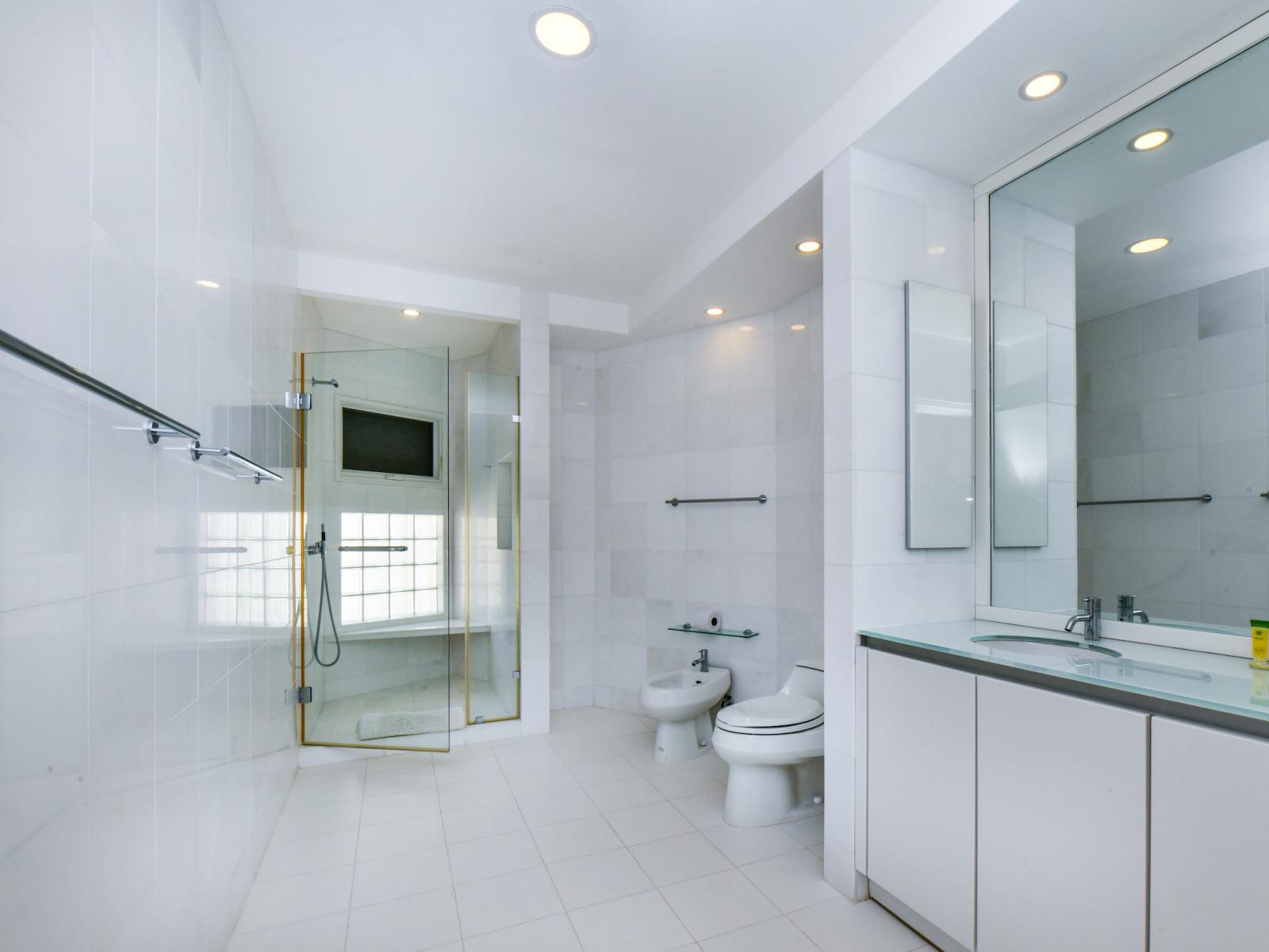 Step into luxury and convenience in our bathroom, boasting a sleek walk-in shower designed for both style and comfort.