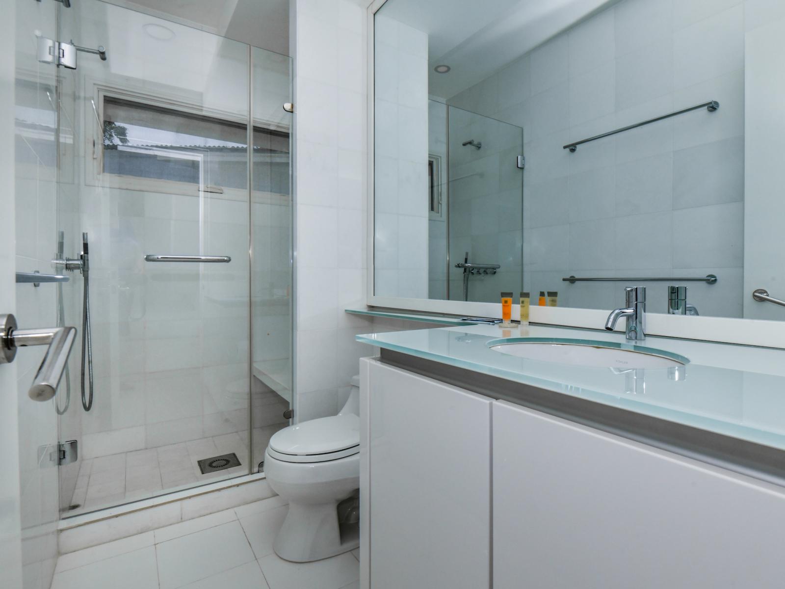 Step into tranquility in our modern bathroom, complete with a luxurious walk-in shower designed for a revitalizing escape from the everyday.