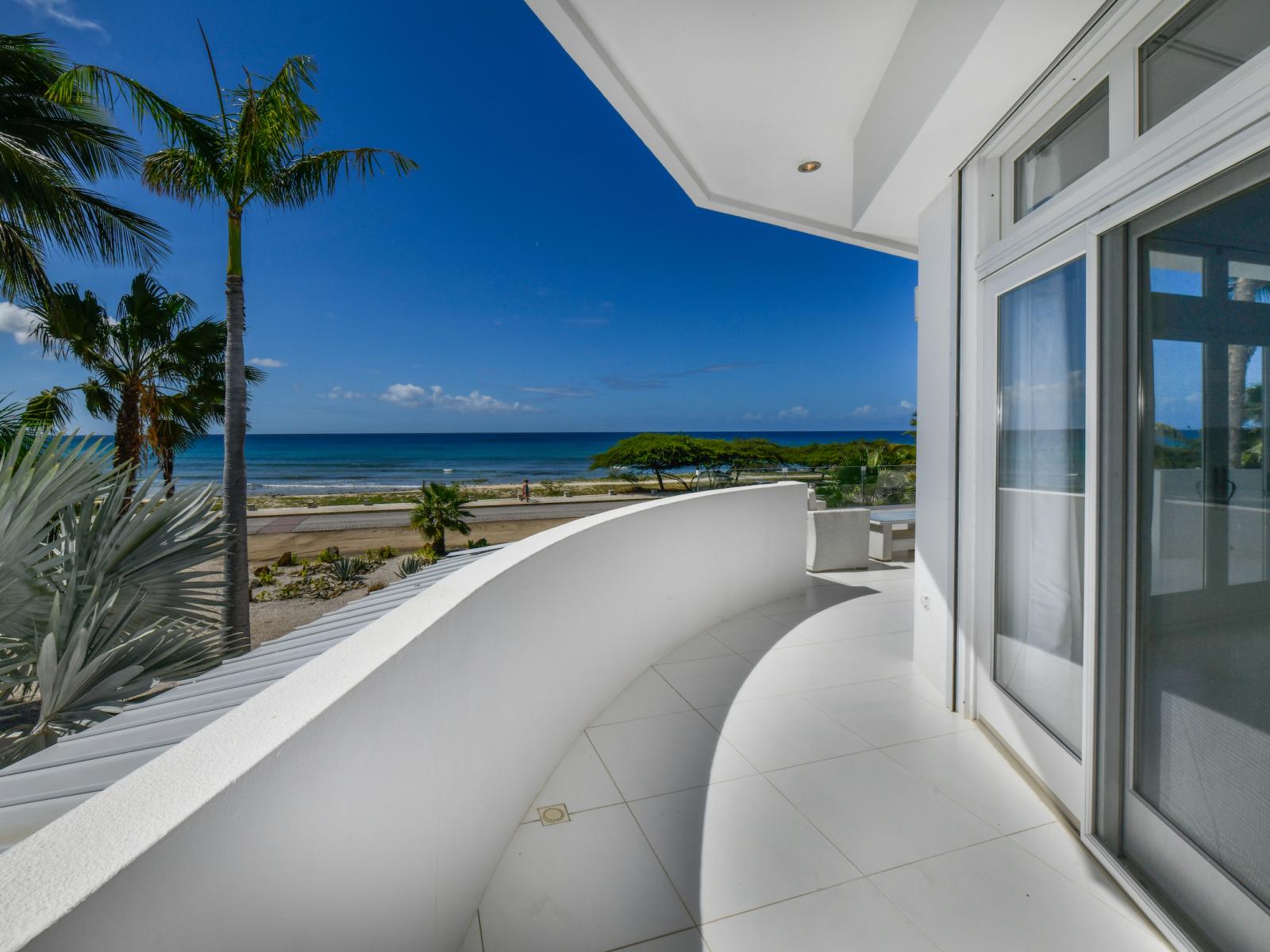 Bask in the beauty of nature's masterpiece from our balcony, where endless horizons and azure waters merge into a breathtaking symphony of tranquility.