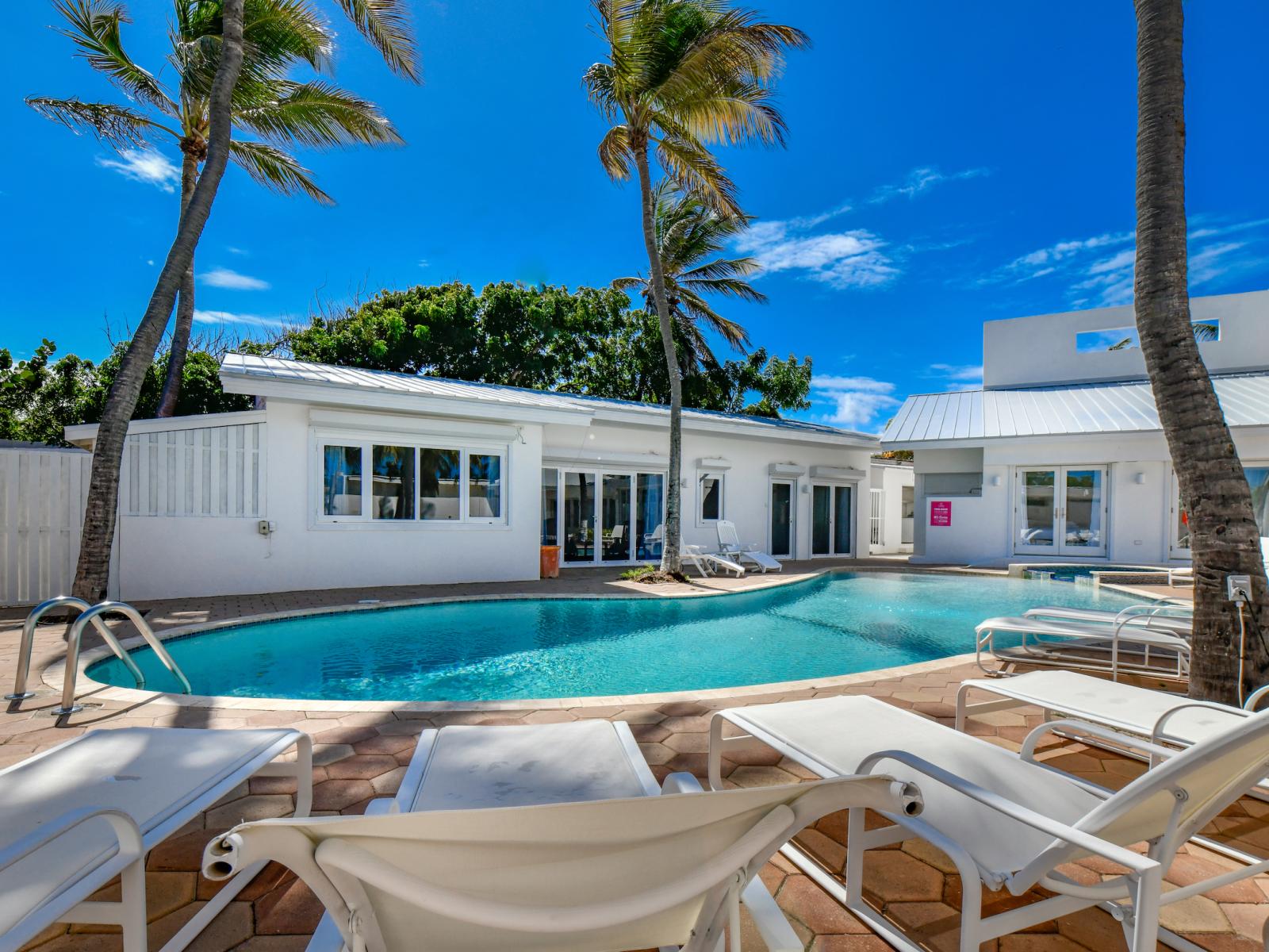 Bask in the sun on our plush poolside chairs. Perfect for a tan or relaxing with a book. ☀️📚 #PoolsideBliss #SunLovers