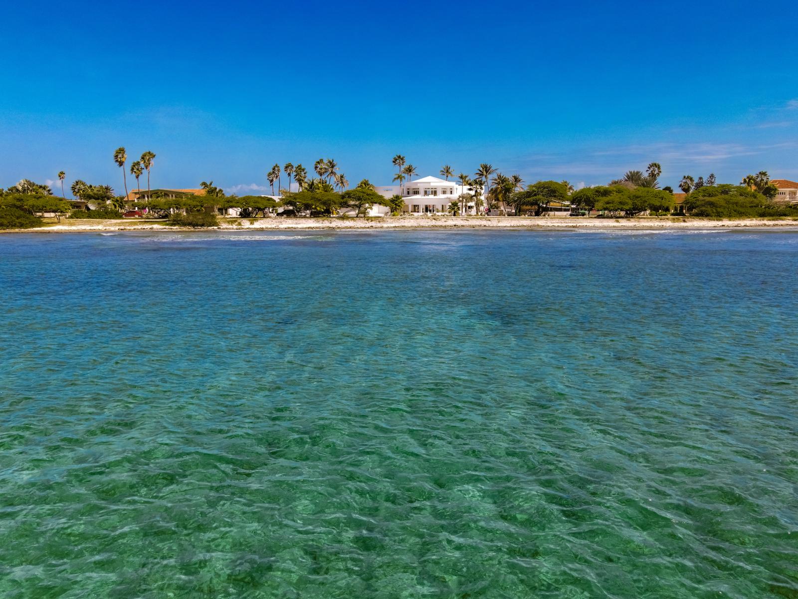 Marvel at our oceanfront villa, blending seamlessly with the horizon and azure waters. A beacon of coastal elegance inviting you to tranquility.