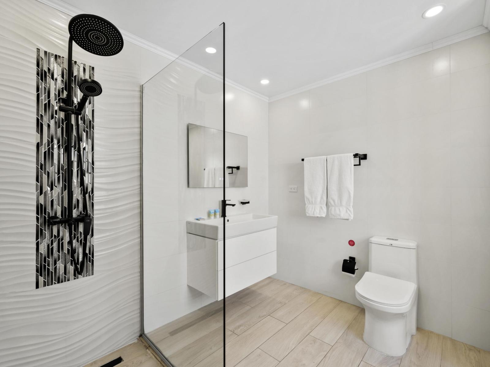 Step into tranquility in our ensuite oasis, where a spacious walk-in shower awaits. Adjacent to the bedroom, this luxurious feature offers both convenience and indulgence, ensuring a refreshing start or a soothing end to your day.