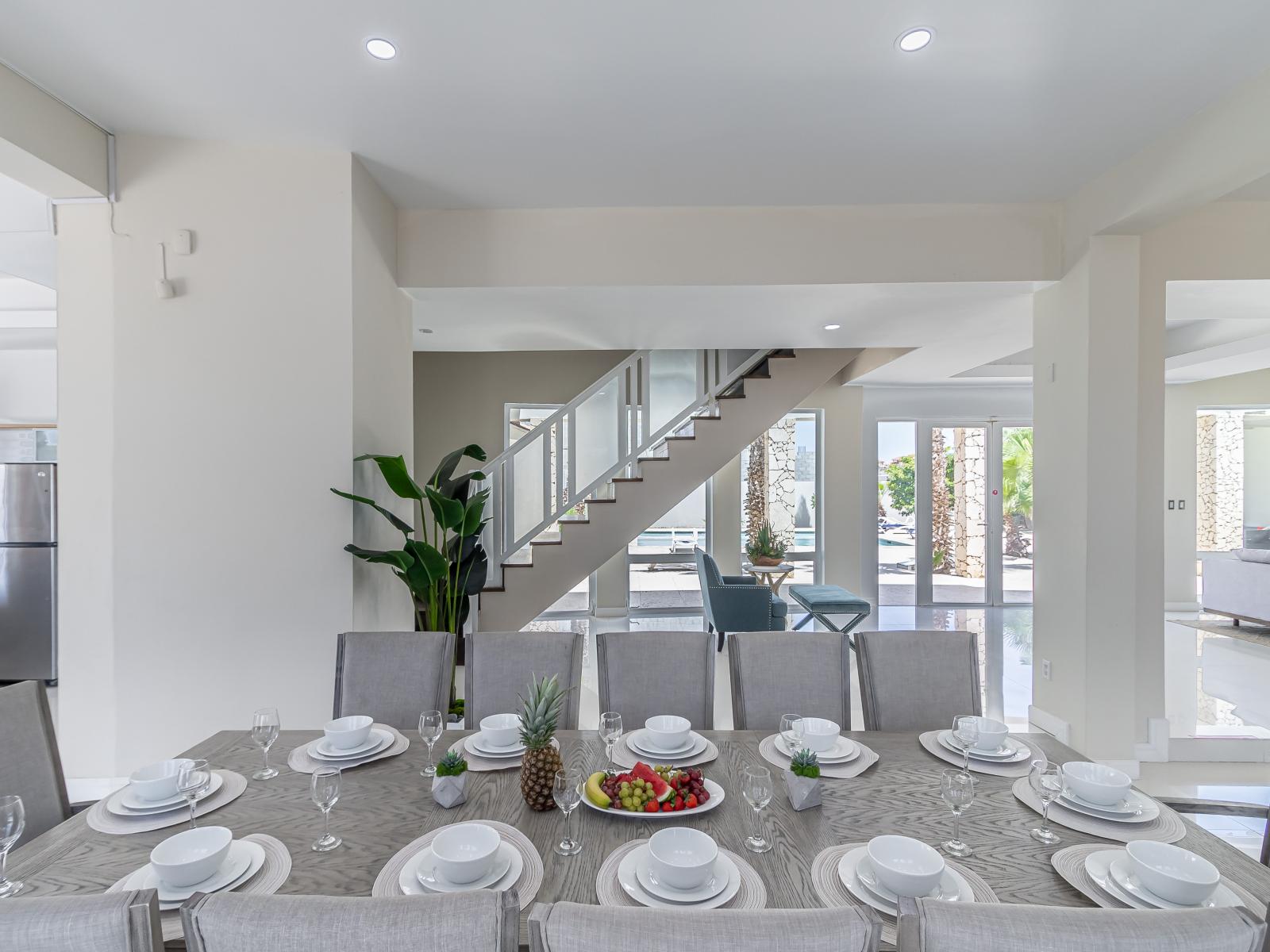 Gather around our inviting dining table, the heart of our home where delicious meals and cherished memories are shared among friends and family.