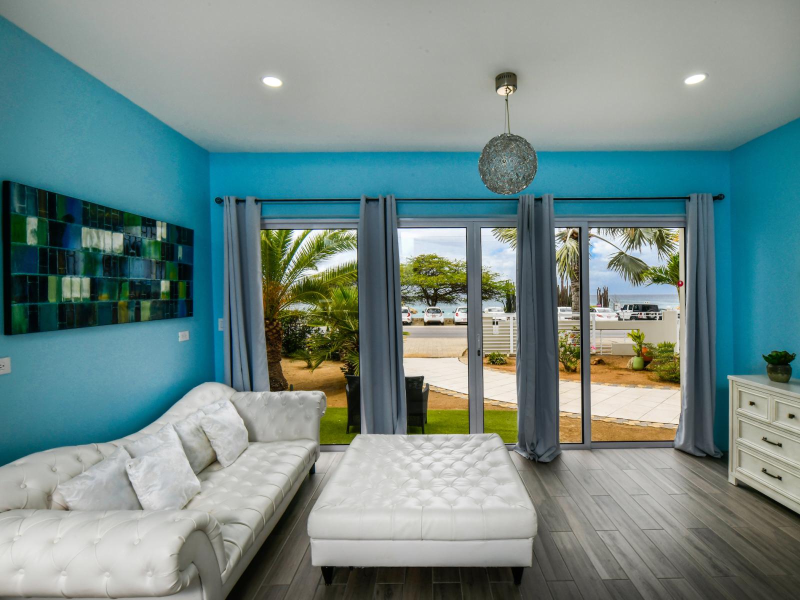 Sitting Area in the Bedroom of the villa - Modern bedroom with sleek design - Spacious bedroom offering comfort and style - Smart TV and Netflix