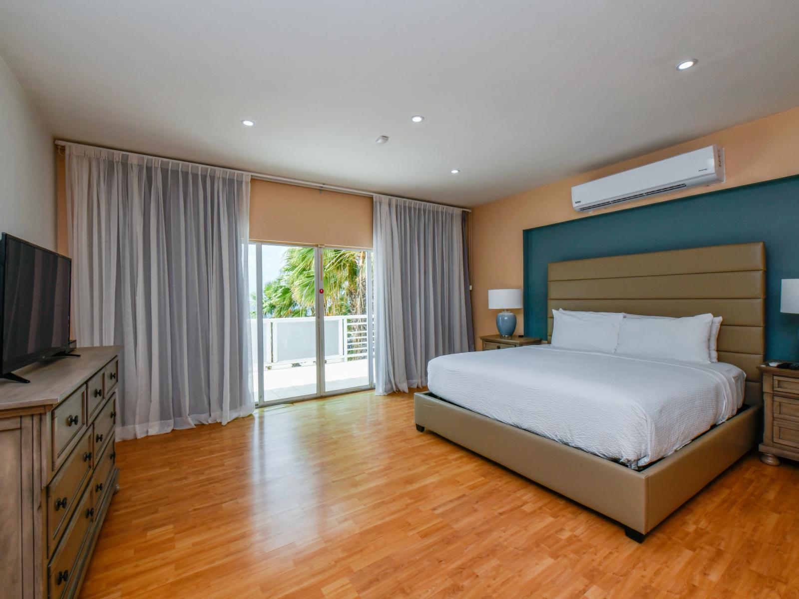 Retreat to the comfort of our spacious bedroom, complete with a luxurious king-sized bed, a TV for entertainment, and an attached bathroom for added convenience and privacy.