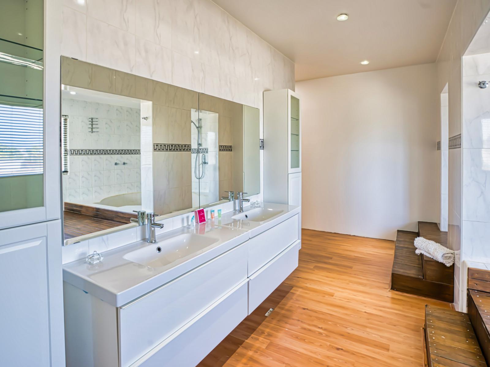 Large bathroom with walk in shower and double sinks