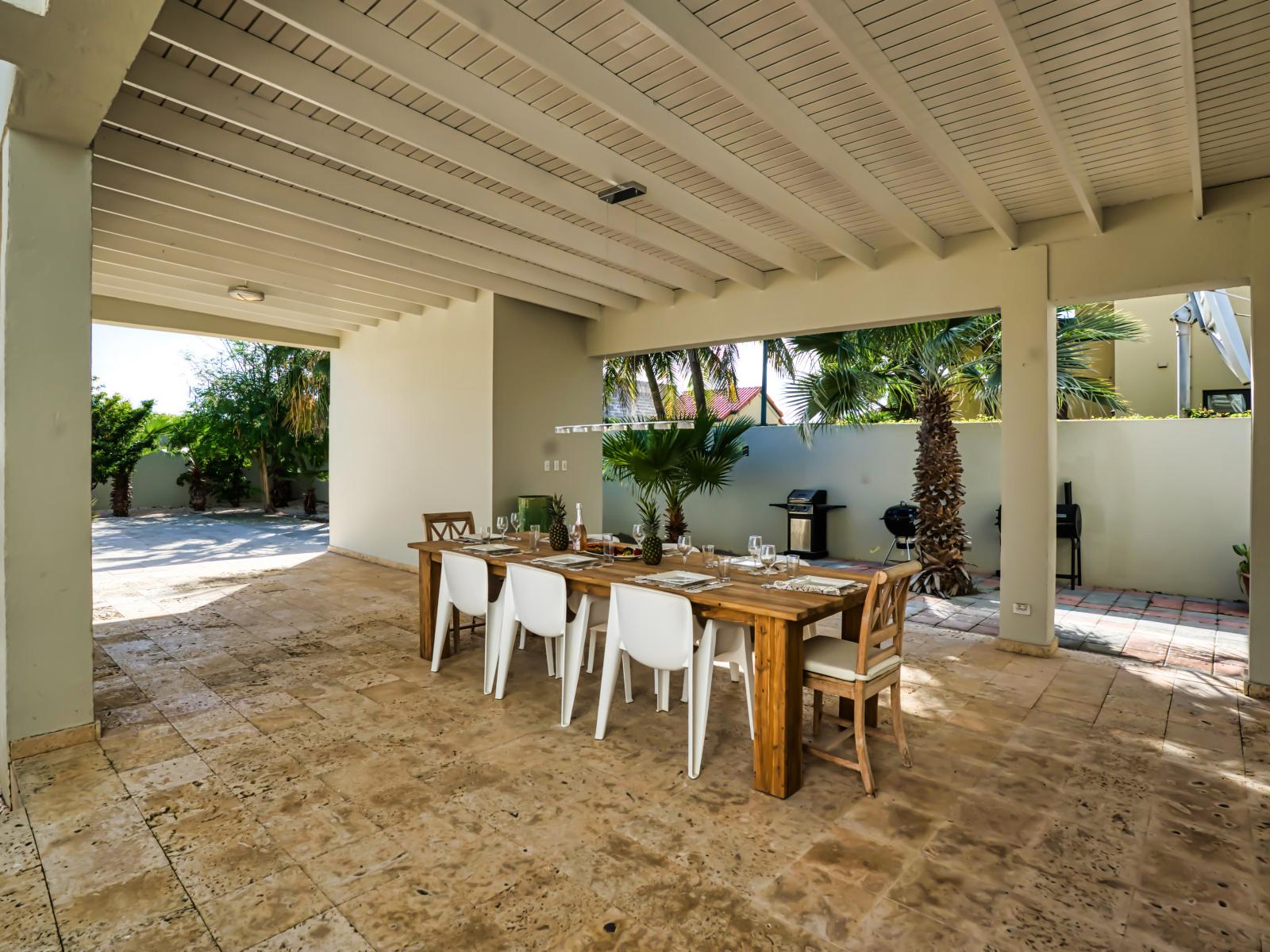 Second Outside dining table to enjoy shaded meals by the pool