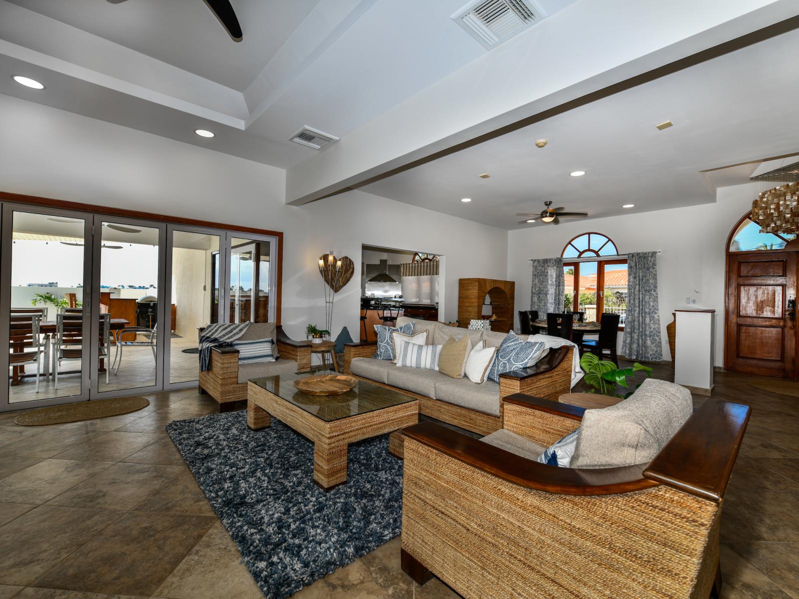 Resplendent Living Area of the 3BR House in Noord Aruba - Cozy seating area conducive to relaxation and socializing - Artfully arranged decor elements, from wall art to decorative accessories - Majestic Chandelier