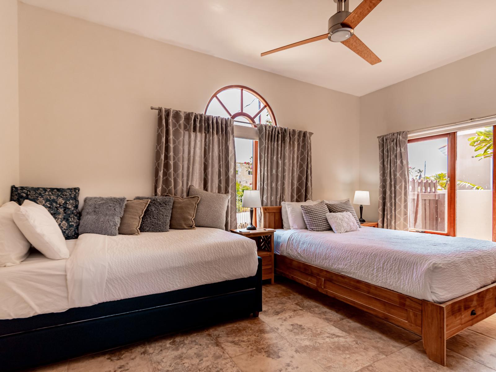 Glorious bedroom of the 3BR House in Noord Aruba - Comfy beds - Elegantly designed room - Beautiful painted walls with decoration - Majestic table lamps - Neat and clean linen - Large windows with beautiful views