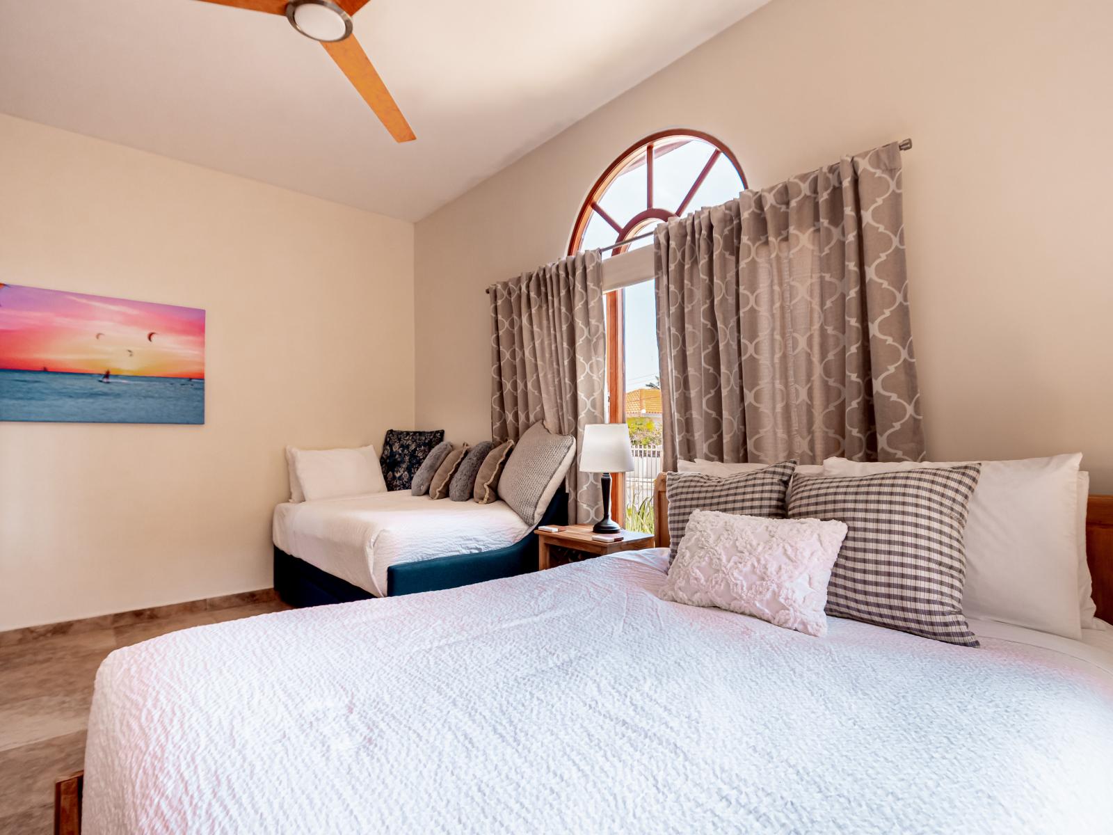 Splendiferous Bedroom of the 3BR House in Noord Aruba - Sleek bedroom and natural light - Cozy seating arrangements - Cozy and inviting ambiance for relaxation