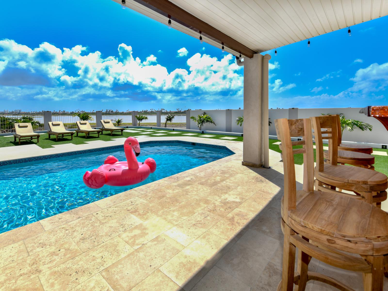 Glamming Pool of the 3BR House in Noord Aruba - Cosy beach chairs available - Dive into refreshing poolside escape - Immerse yourself in the cool elegance of our pool - Experience ultimate relaxation in our poolside paradise