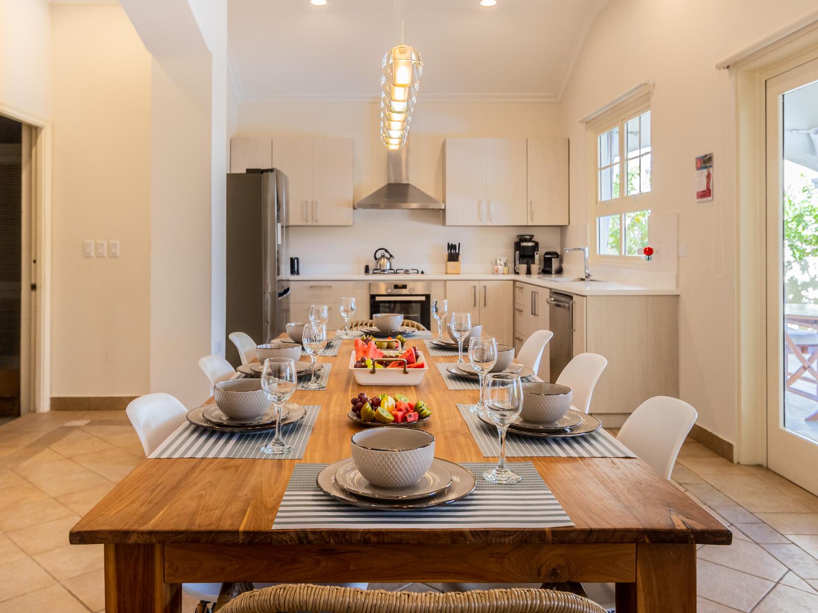 Refined Dining Area of the Villa in Aruba - 8 Persons Dining - Artfully arranged table settings for a touch of elegance - Bright And Airy