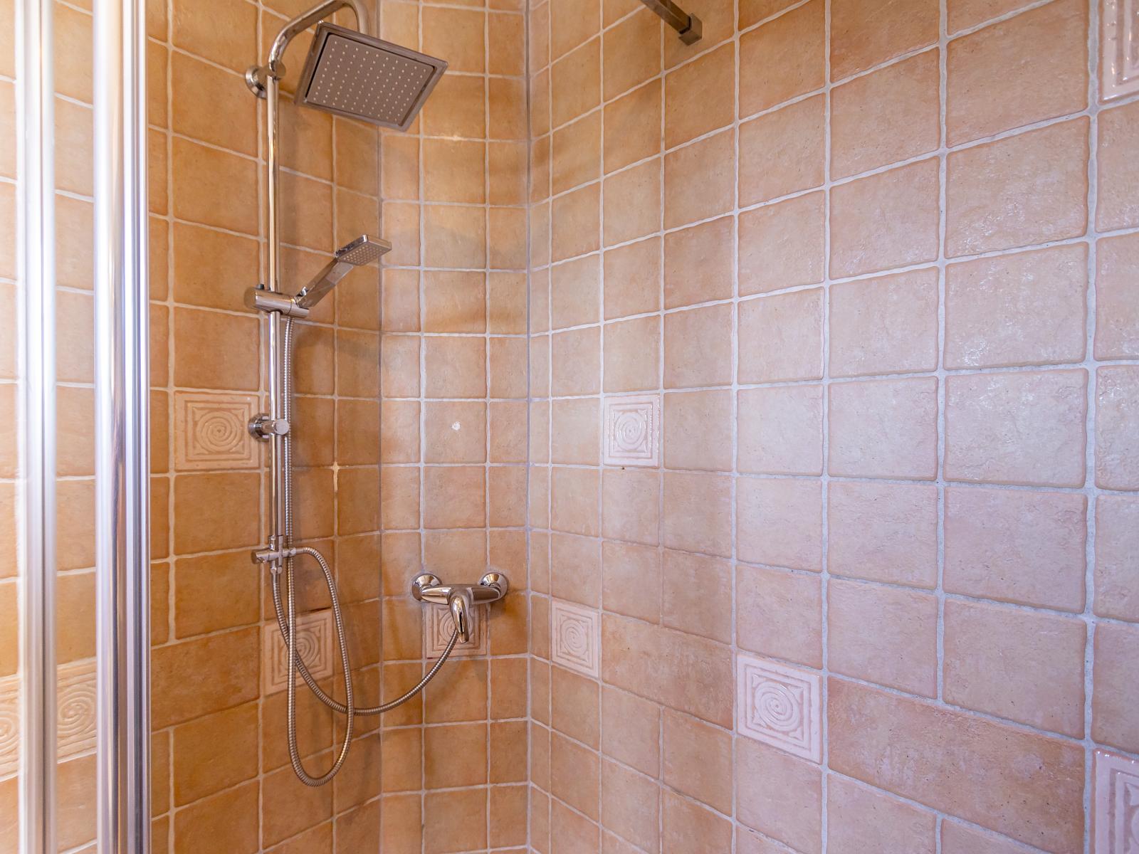 Main Bathroom 1 features a double sink and a walk-in shower for added luxury and convenience.