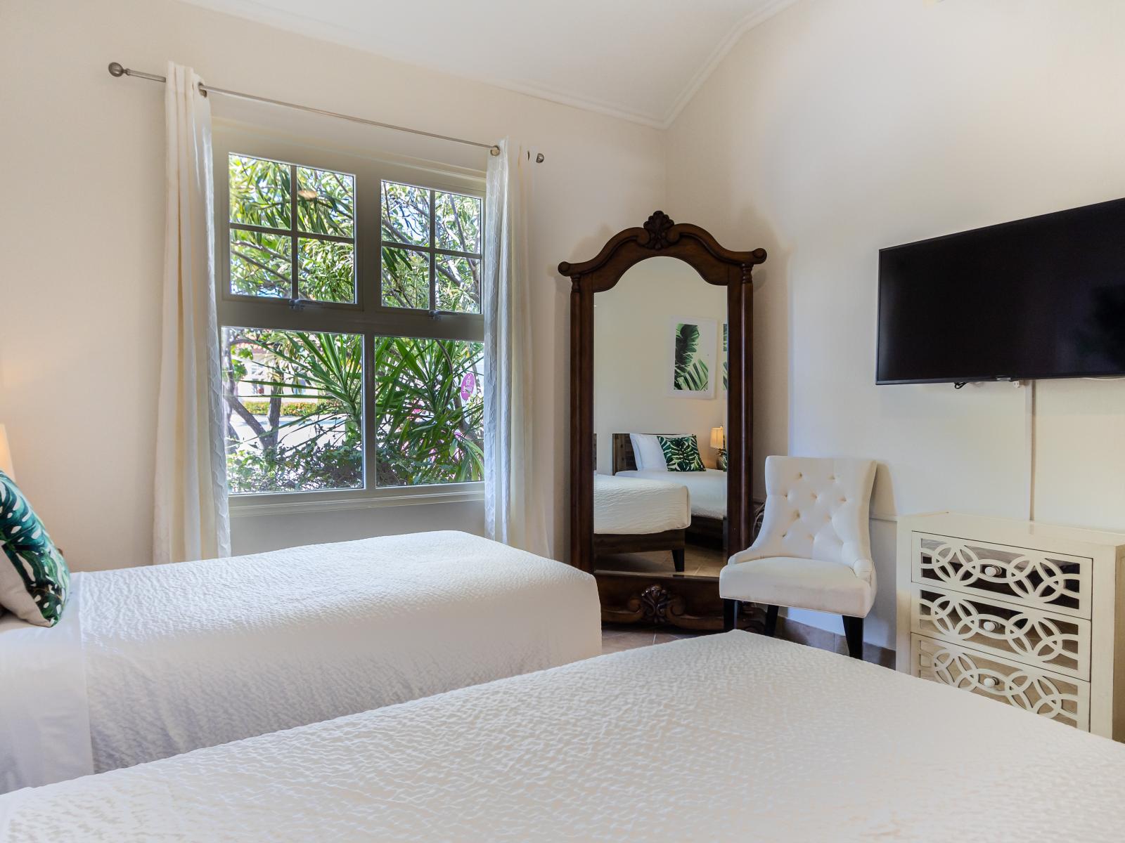 Exquisite Bedroom of the Villa in Aruba - Bright and airy bedroom with large windows for natural illumination - Thoughtfully Designed space with Full size mirror - Smart TV and Netflix - Twin single bed and Elegant Decor