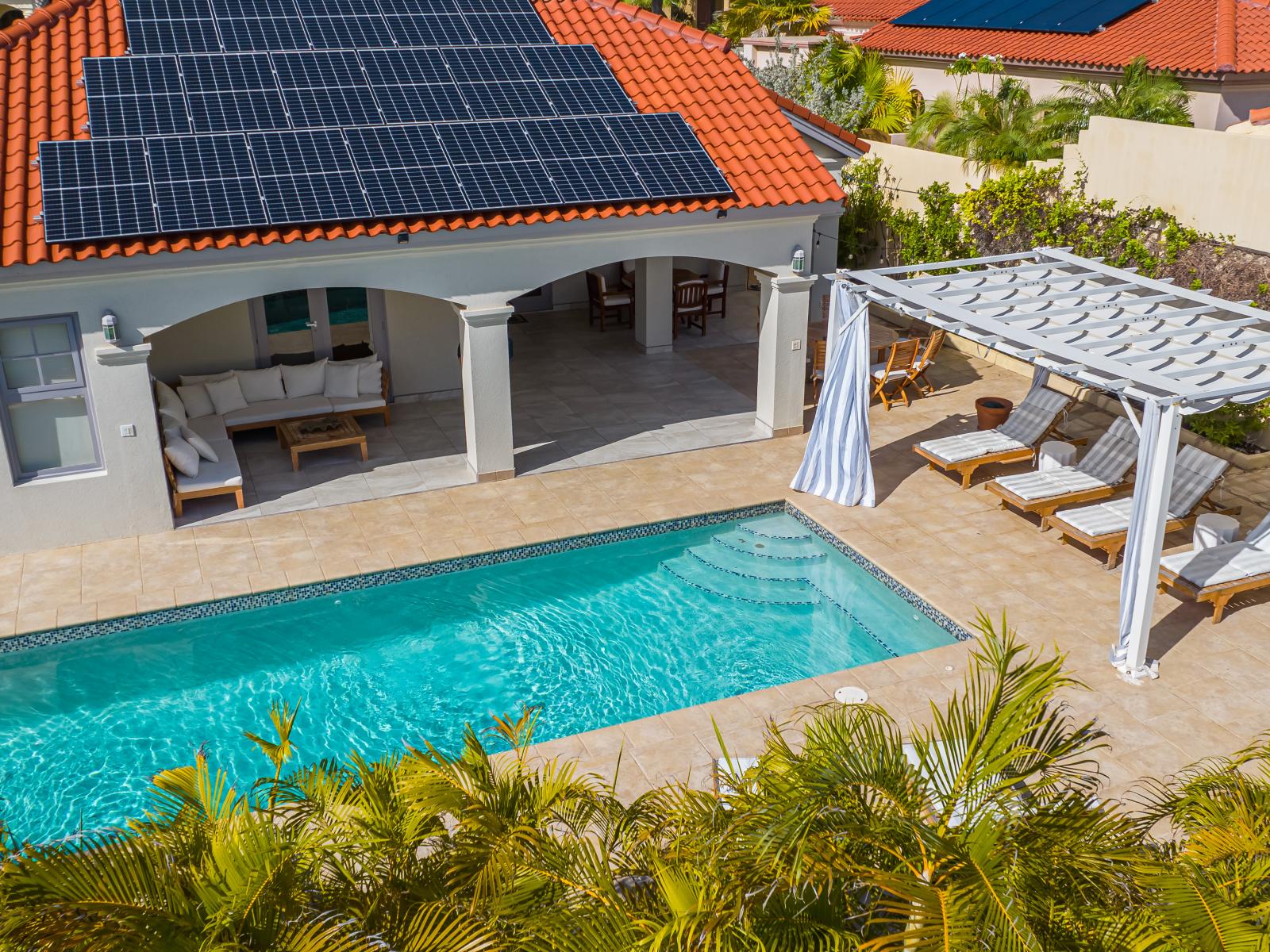 Private pool area featuring a cabana for ultimate relaxation and luxury.