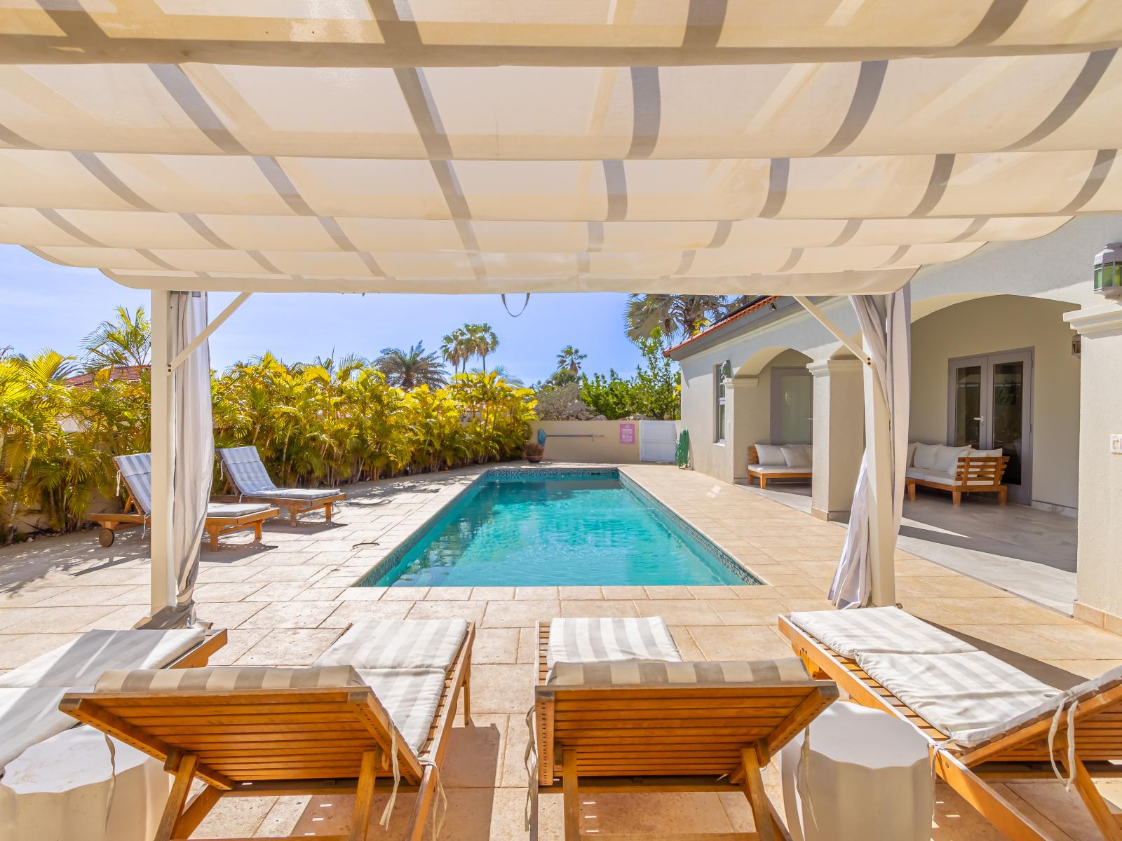 Private pool area with a stylish cabana, perfect for unwinding in style.