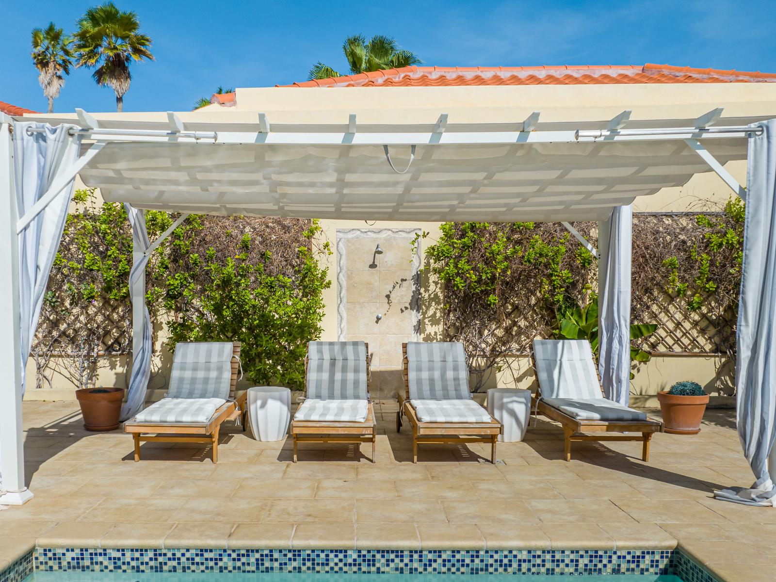 Private pool area with a chic cabana, offering a luxurious retreat for relaxation.