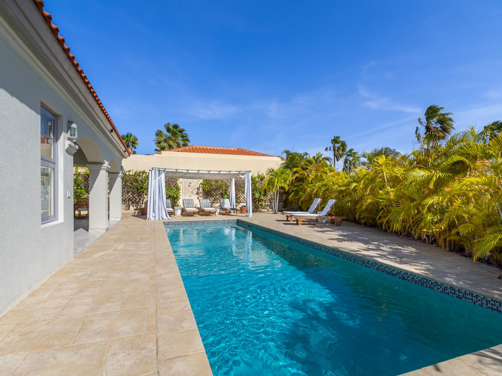 Private pool area with a chic cabana, offering a luxurious retreat for relaxation.