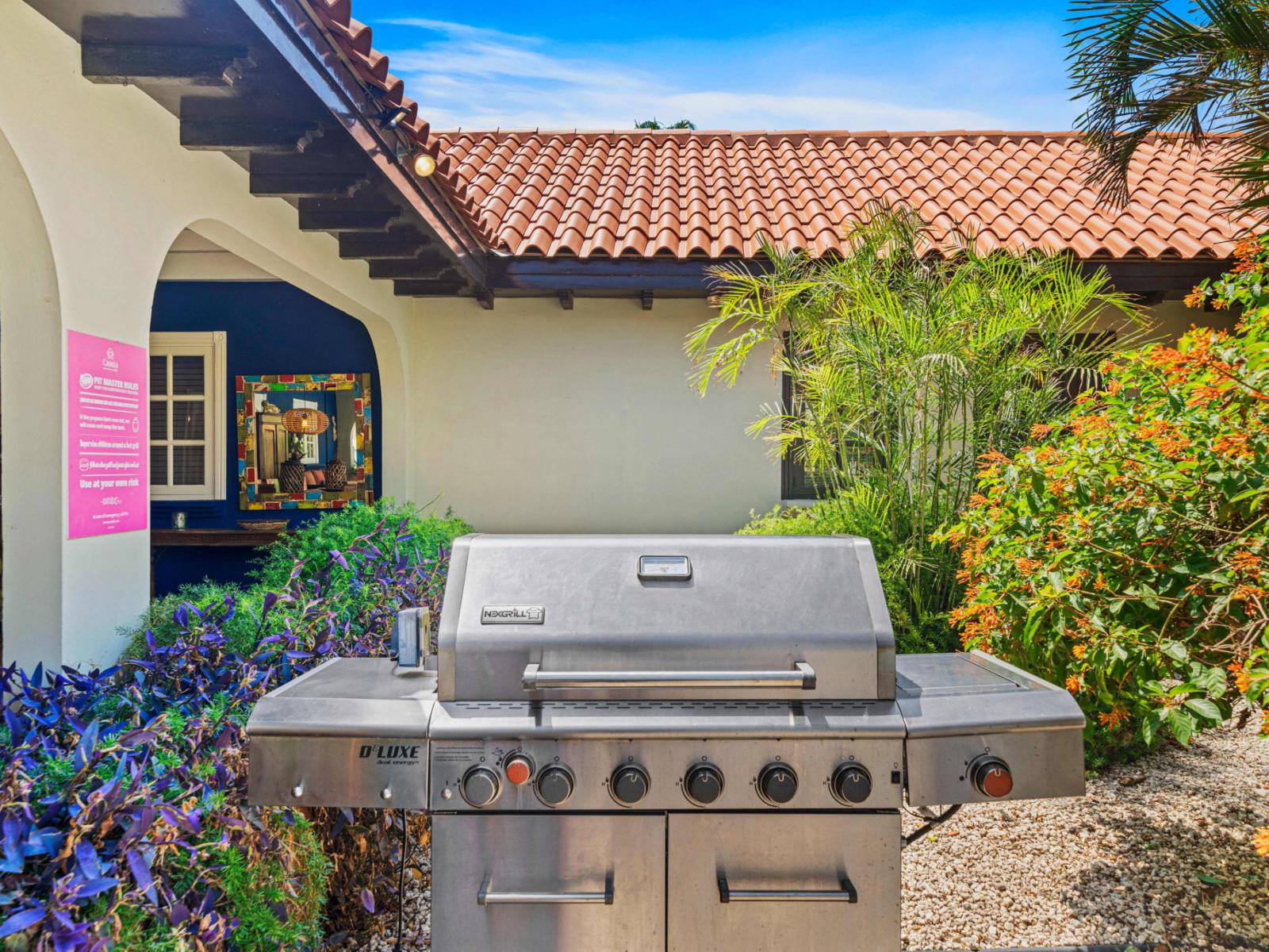 Dine under the stars in our dining and grilling area, featuring a spacious dining table and a well-equipped grill.