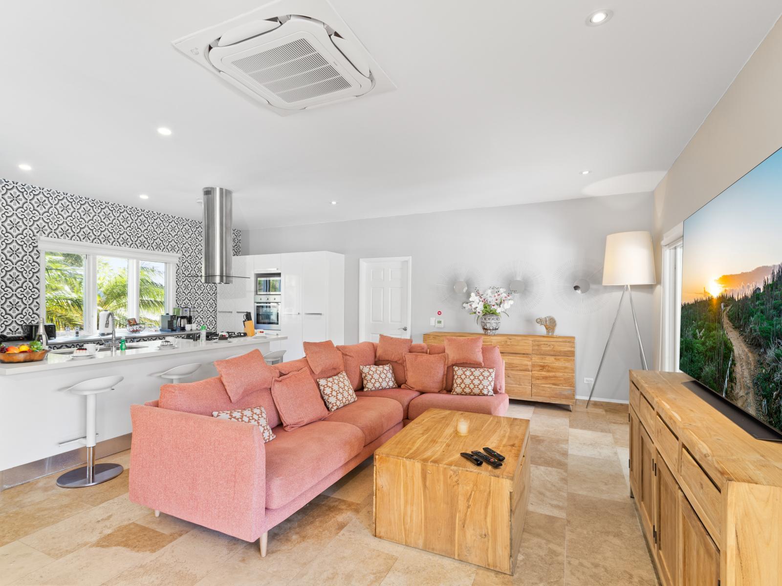 Resplendent Living Area of the Villa in Noord Aruba - Natural light floods the room, enhancing its warmth and inviting atmosphere - Smart TV and Netflix - Harmonious color scheme with pops of accent colors for visual interest