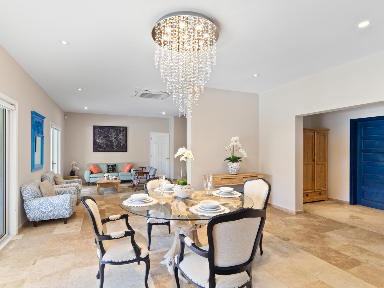 Charming Dining Area of the Villa in Aruba near Palm Beach - 4 Persons Dining - Quality materials, such as a sleek dining table and comfortable chairs - Modern Design - Intimate ambiance created through soft, ambient lighting