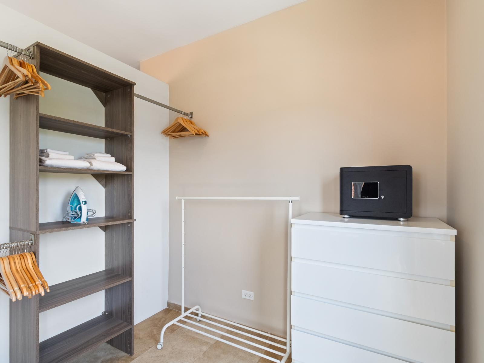 Maximize storage space while ensuring the safety of your belongings with our closet area and safe. - Experience peace of mind with our closet area complete with a secure safe for your personal items. - Spacious closet area featuring a secure safe.