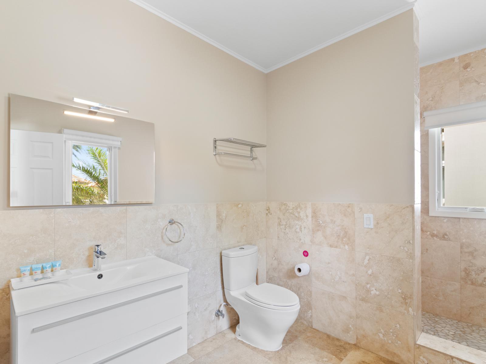 Lavish Tiled Bathroom of Villa Aruba - Separate shower area - Neat and Clean Bathroom - Elegant lighting