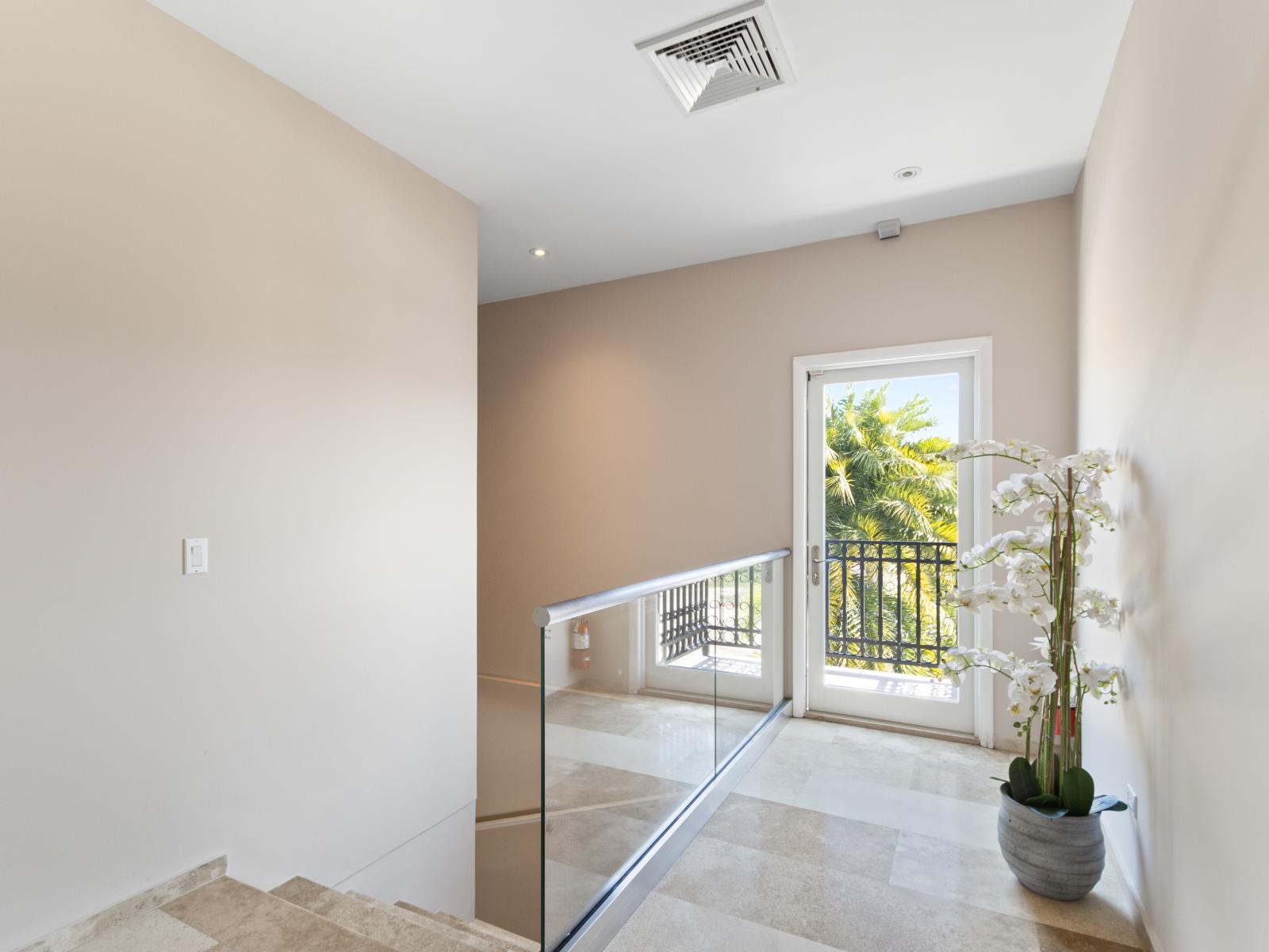 Elegant staircase leading to the second floor.