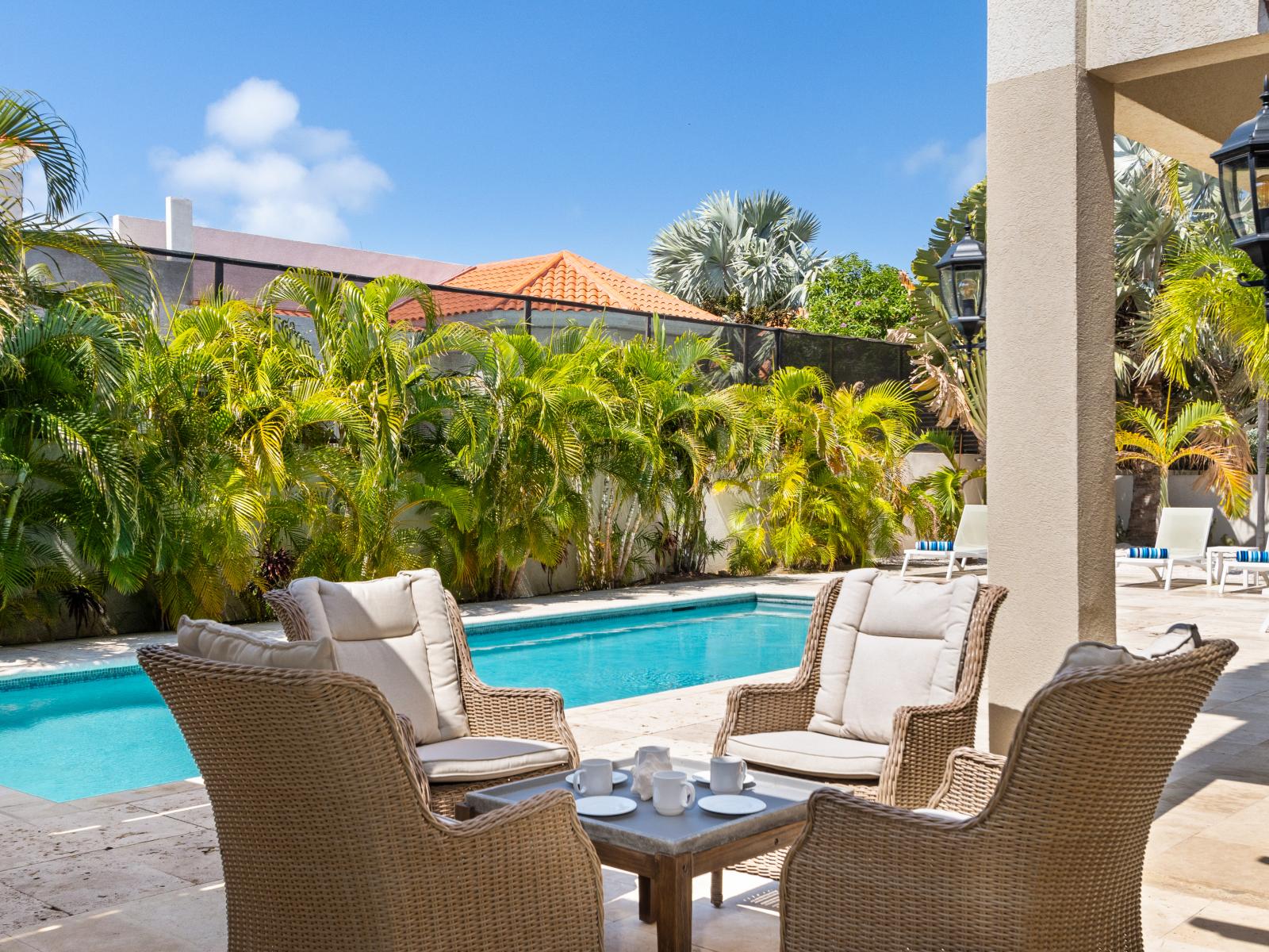 Relax in comfortable poolside chairs.