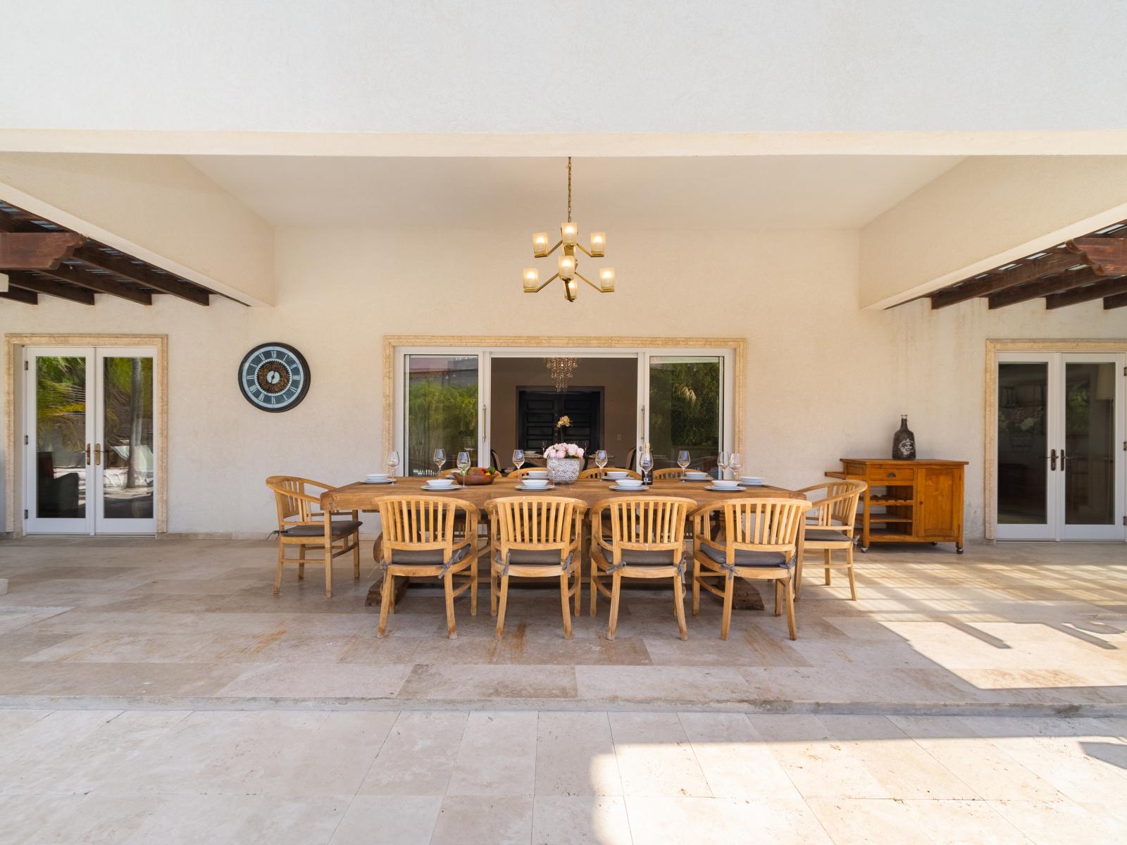 A spacious outdoor dining table that comfortably seats up to 10 guests.