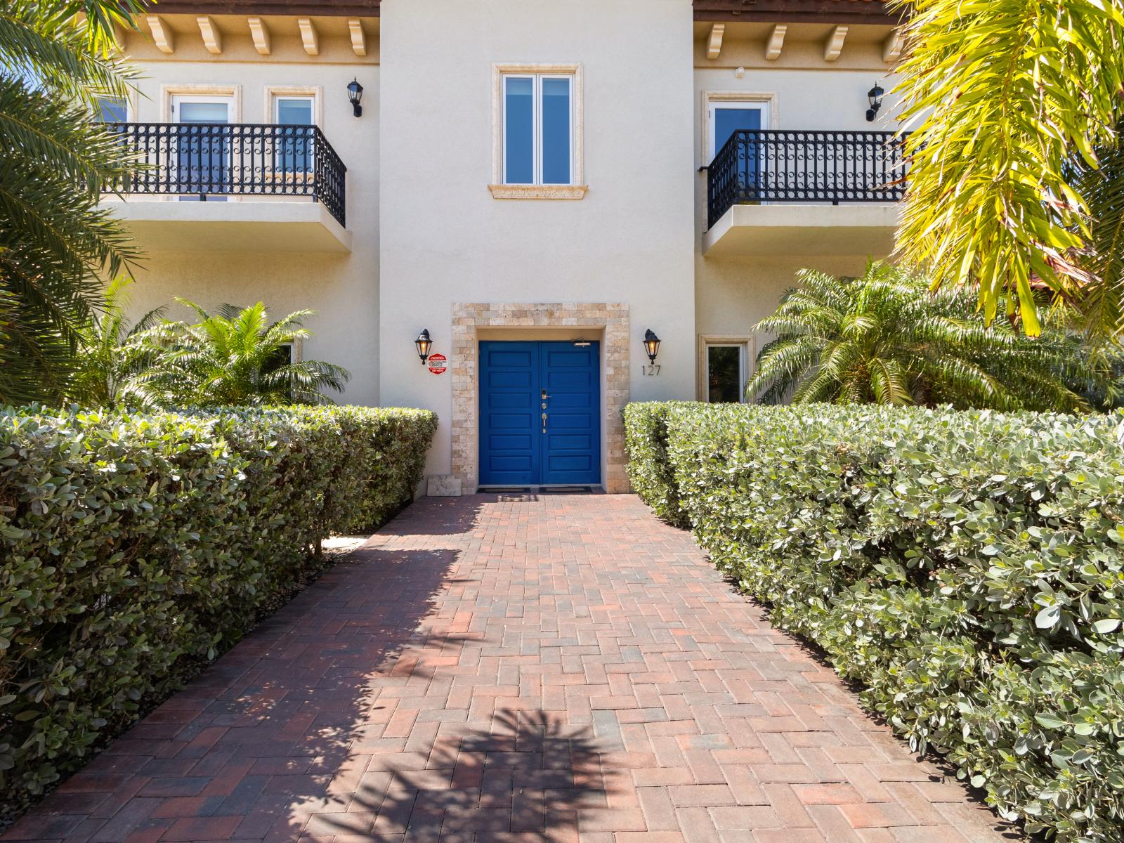 Welcome guests with the vibrant front door of the villa.