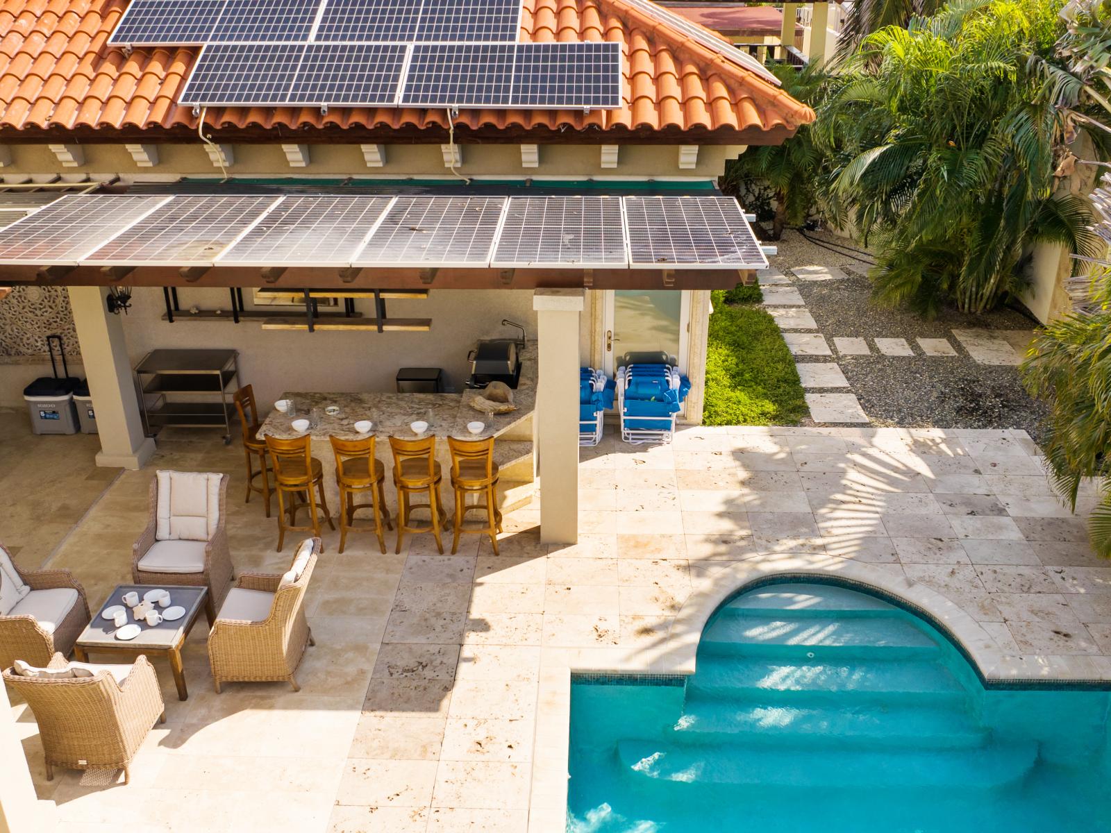 Outdoor kitchen and pool, perfect for entertaining and relaxation.